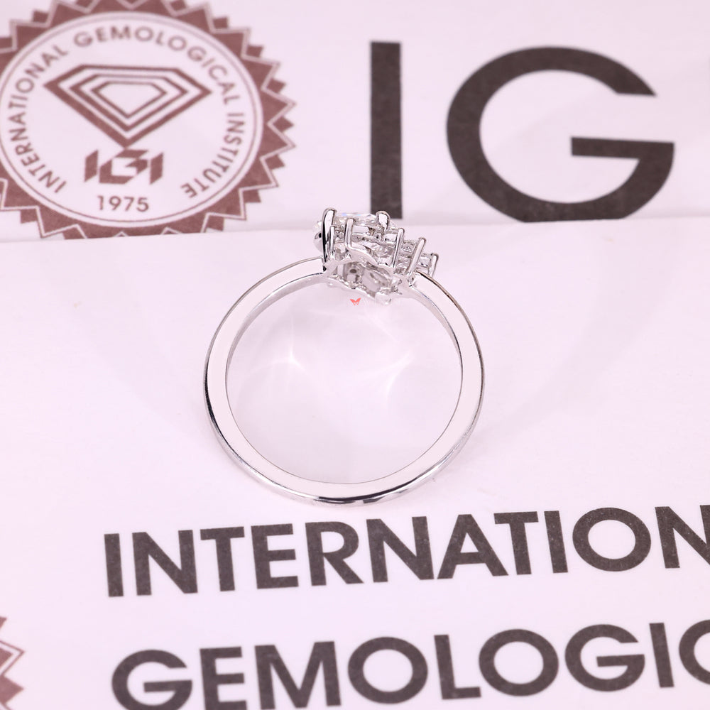 Handmade oval cut diamond ring with halo detail.

