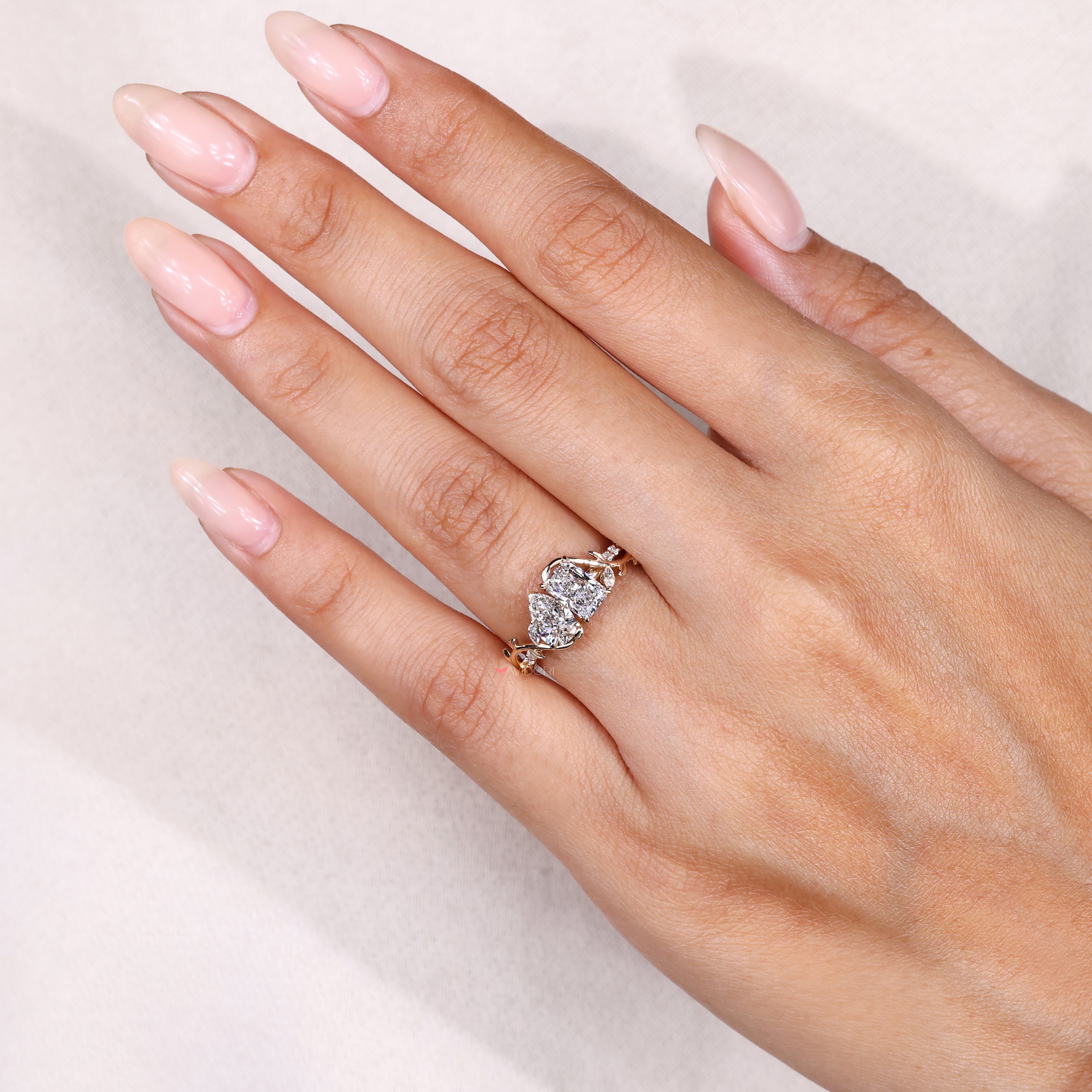 Toi et moi ring with round and marquise diamonds.
