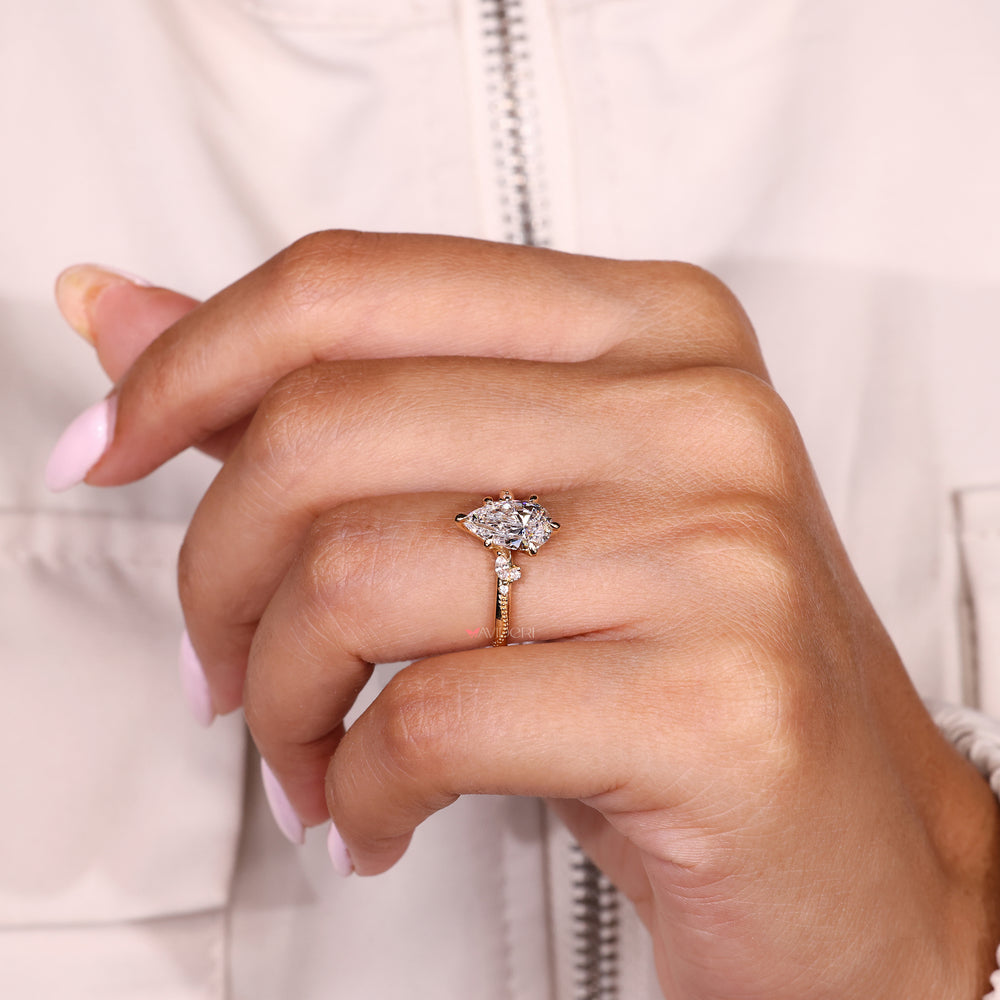Handmade pear cut diamond ring with six claw prongs
