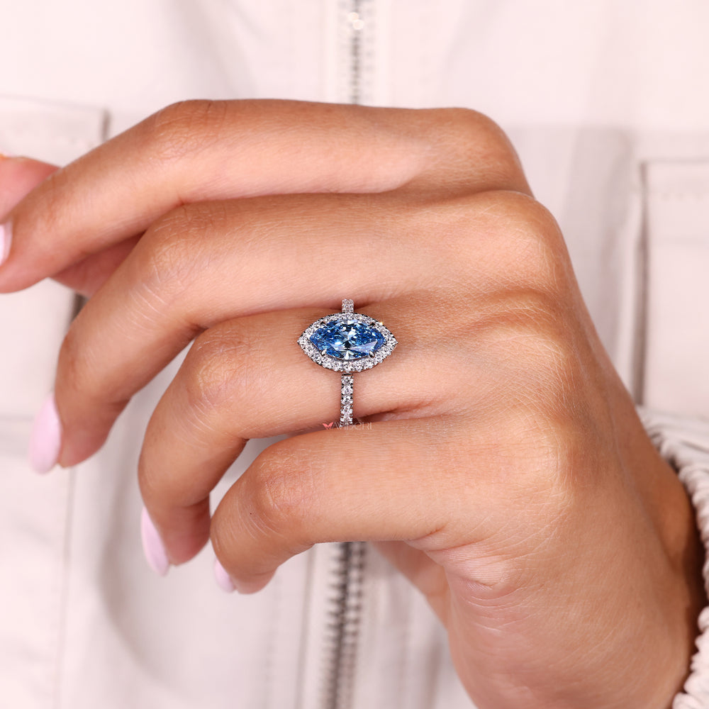 Handmade marquise engagement ring with round halo diamonds
