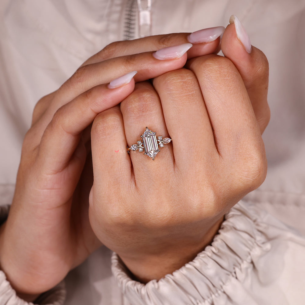 Hexagon diamond ring with round and marquise accents.
