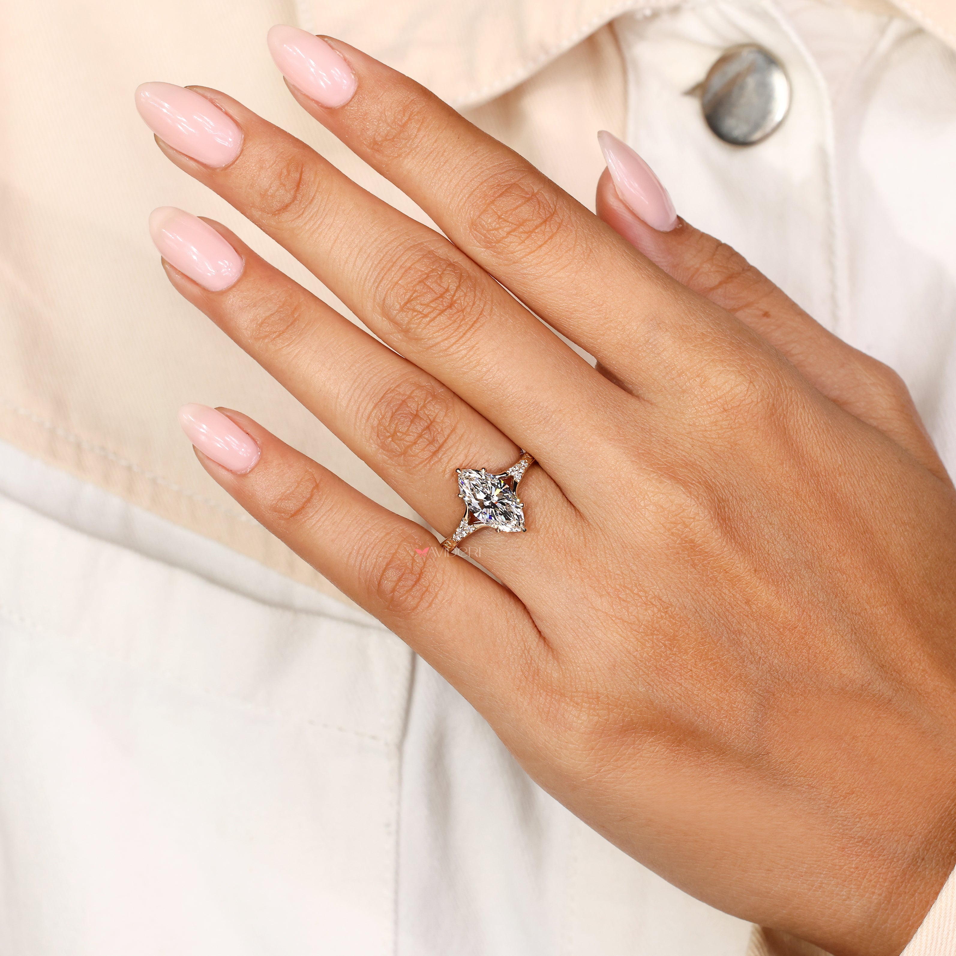 Marquise cut lab diamond ring with round side stones
