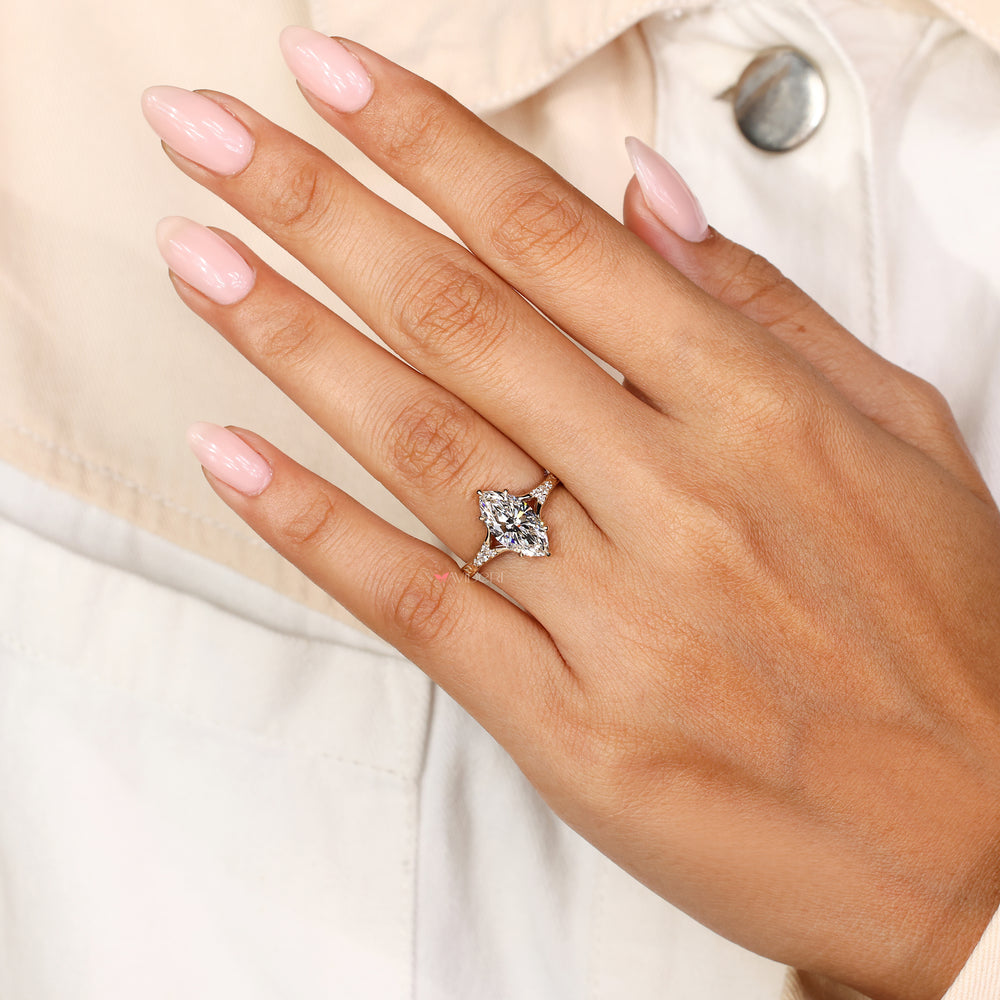 Marquise cut lab diamond ring with round side stones
