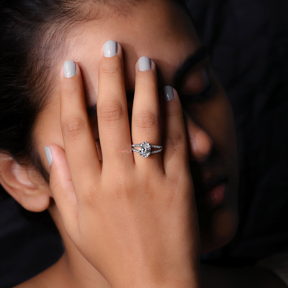 Oval cut diamond ring with elegant hidden halo style.