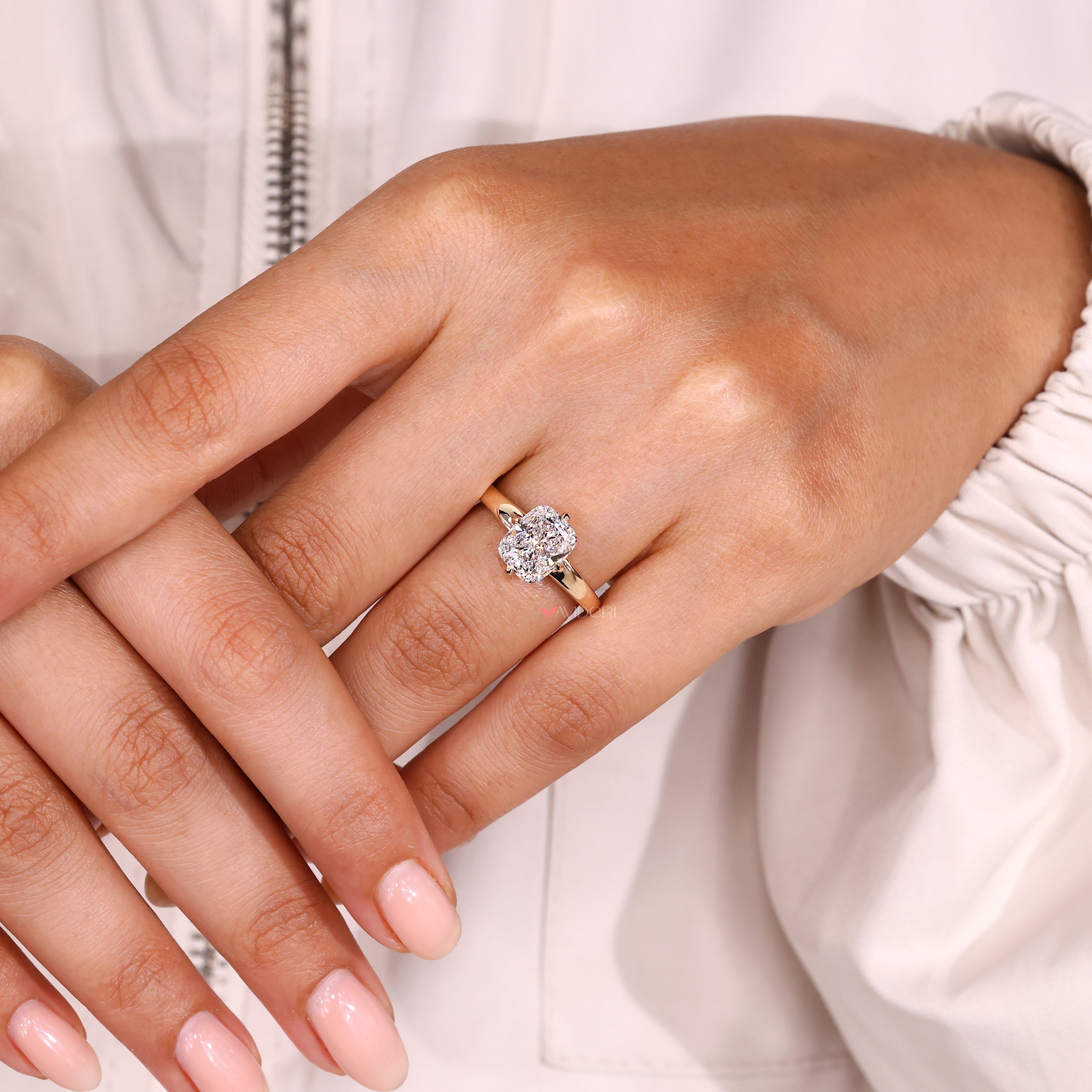 Cushion cut ring with basket setting design.
