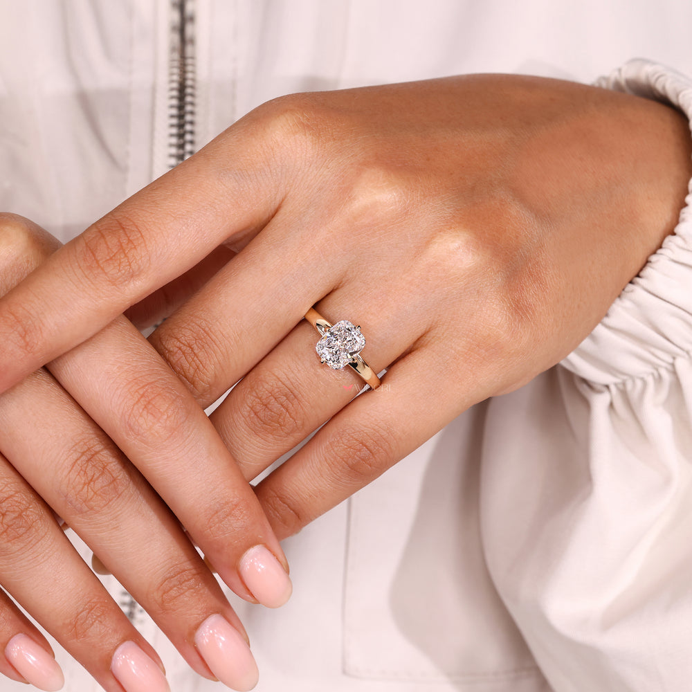 Cushion cut ring with basket setting design.
