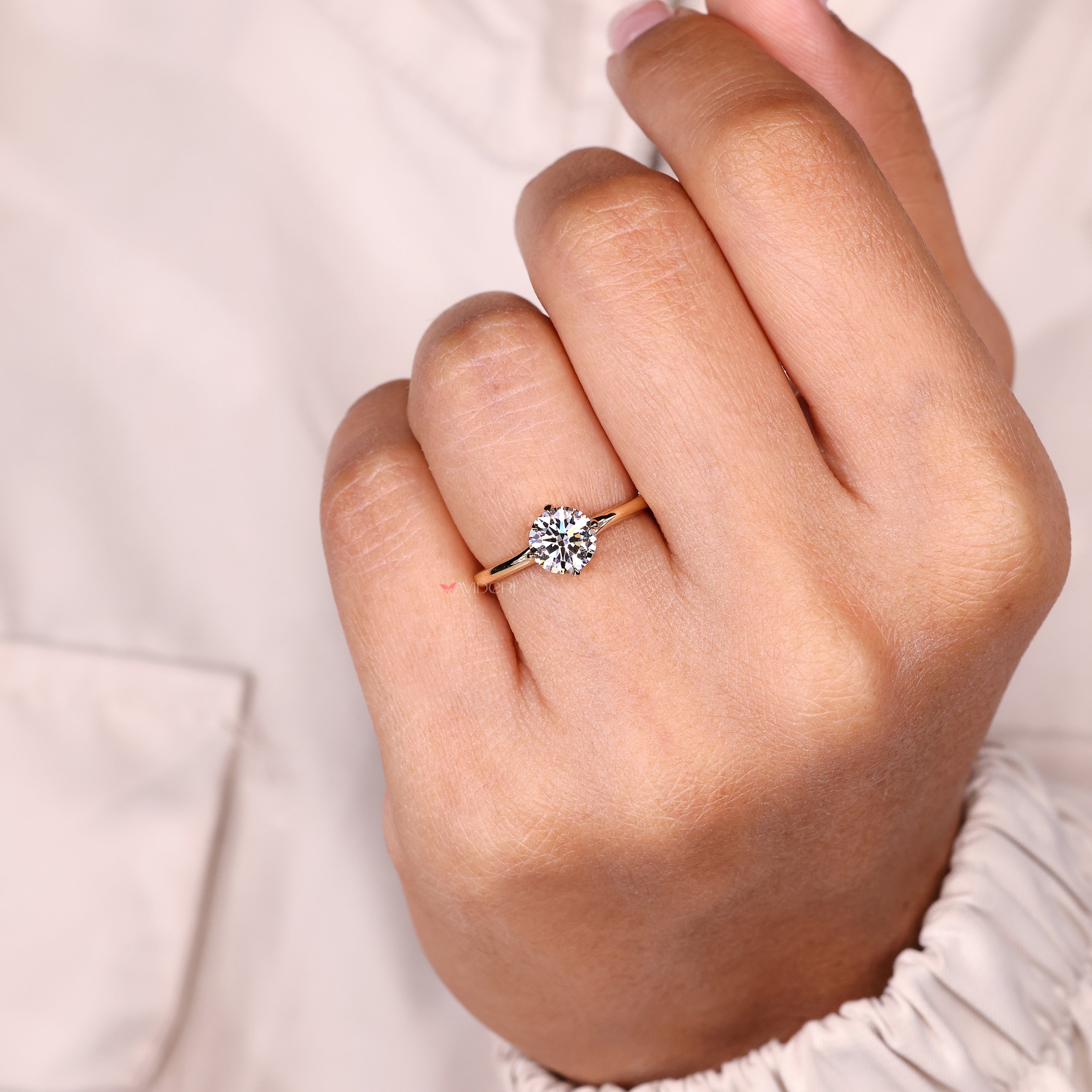 Round lab diamond ring with solitaire and bypass setting.
