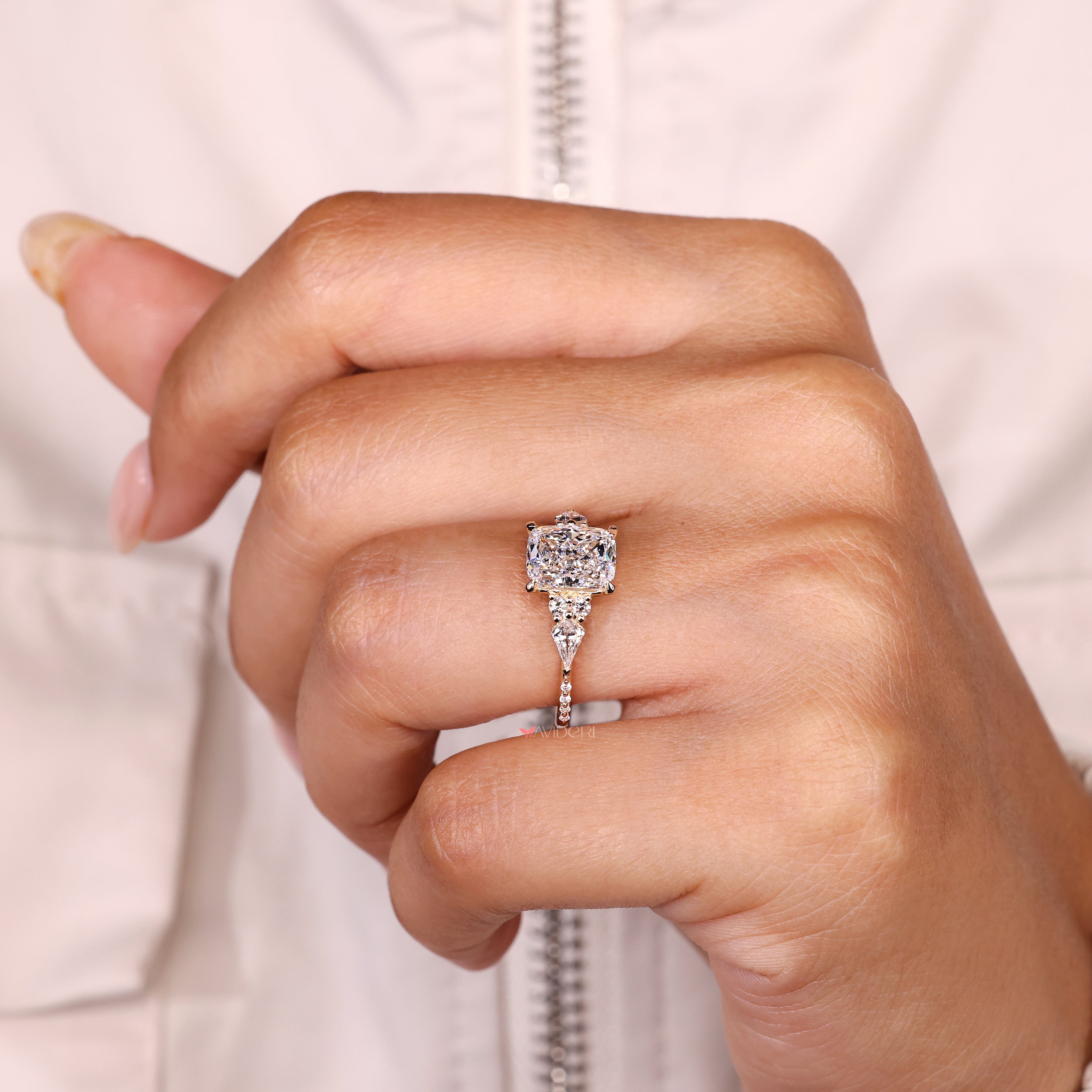 Handmade cushion diamond ring with four claw prong setting.

