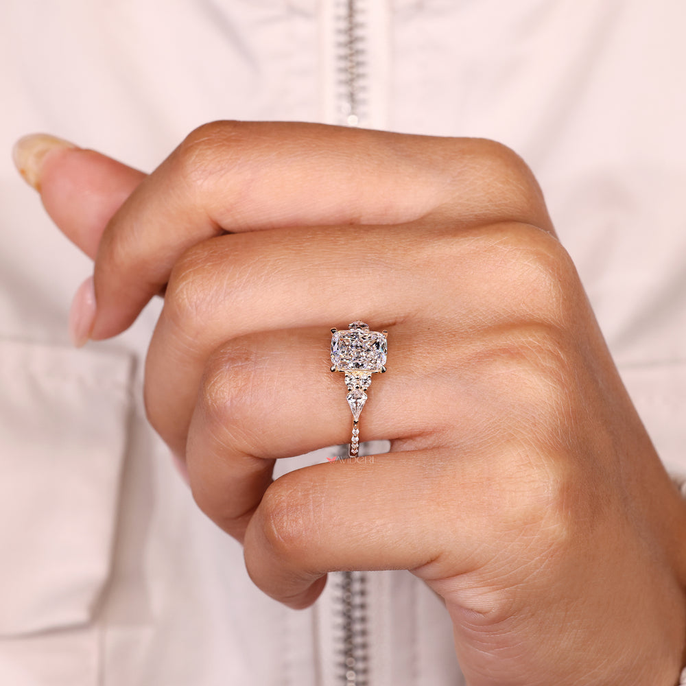 Handmade cushion diamond ring with four claw prong setting.
