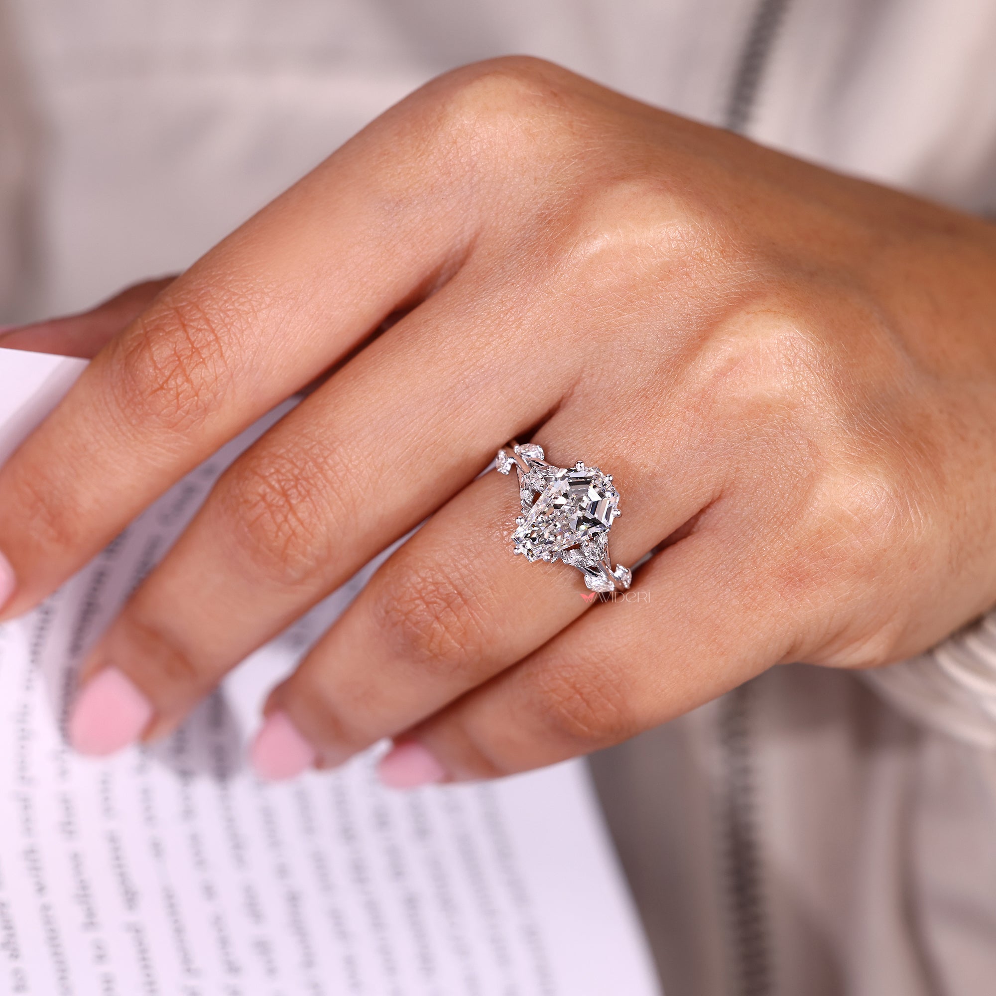 Nature inspired coffin cut diamond ring cluster style.
