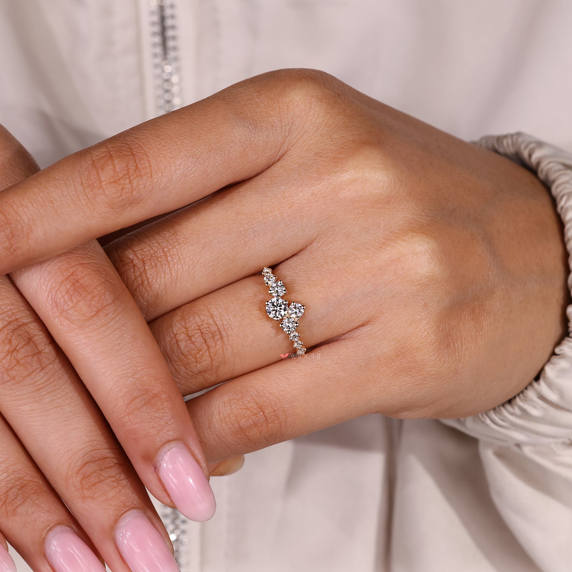 Handmade round diamond ring with refined cluster design.