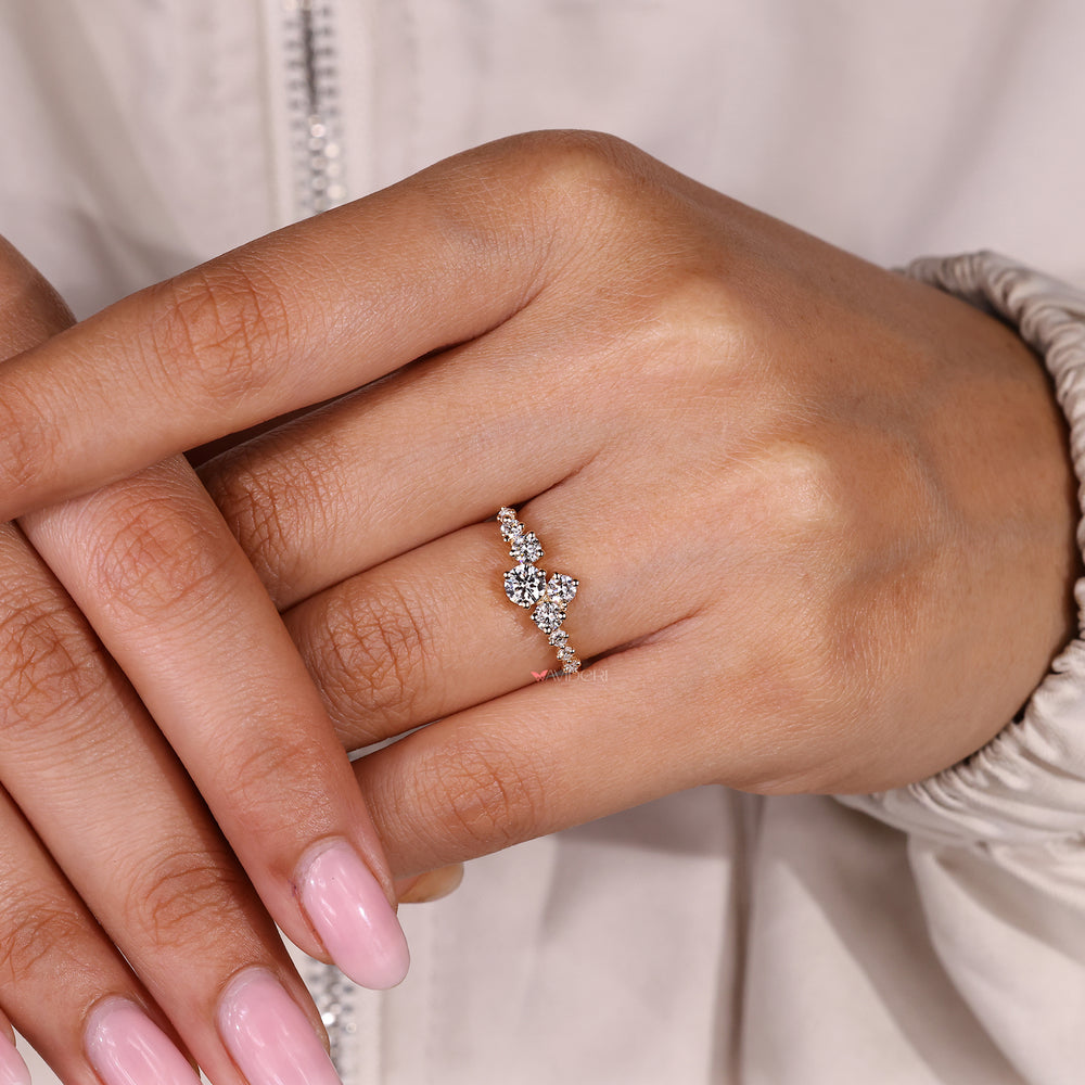 Handmade round diamond ring with refined cluster design.