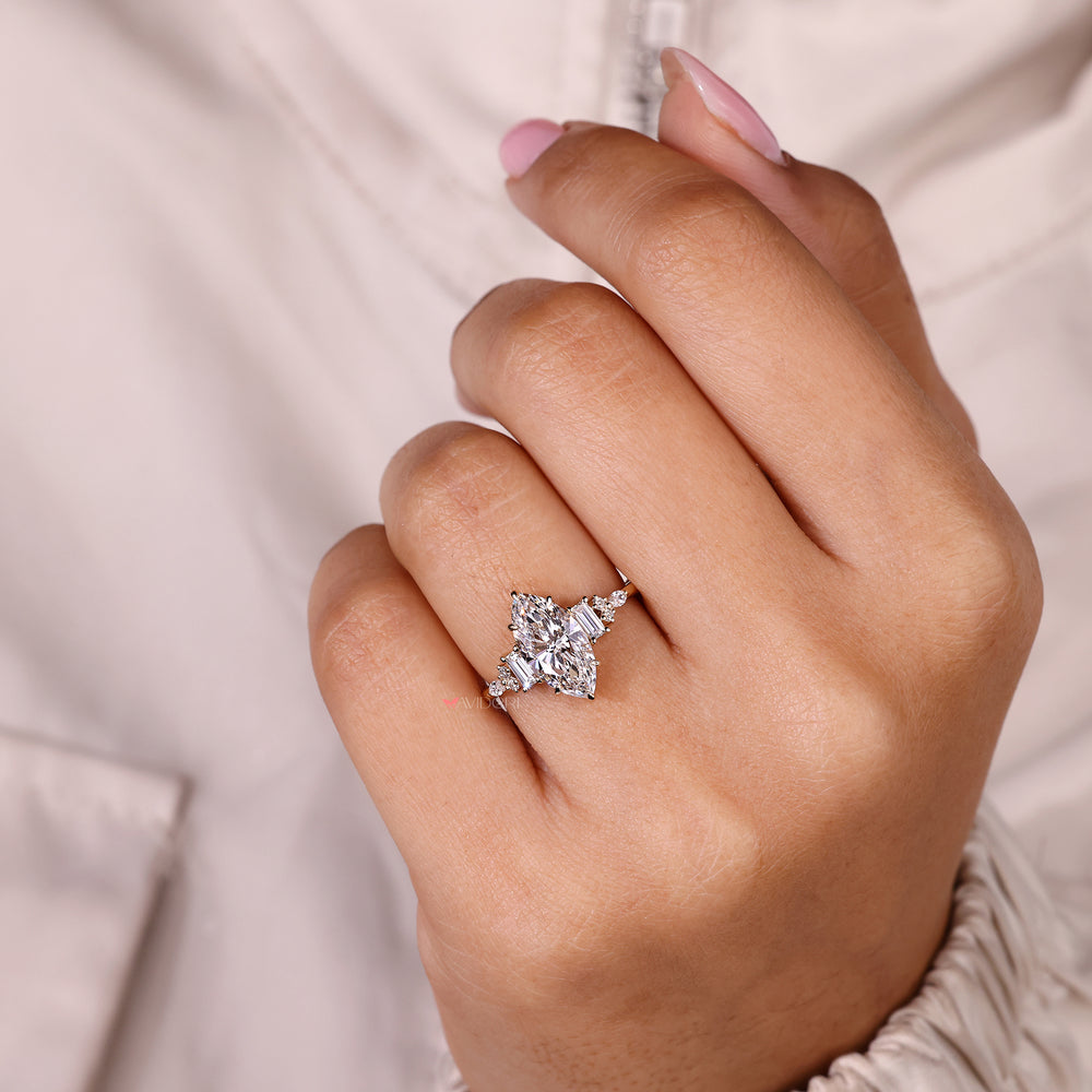 Handmade marquise diamond ring with nine stone design.
