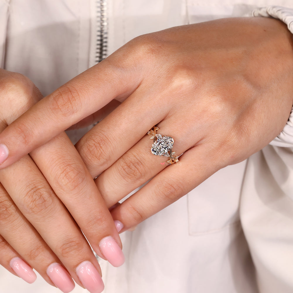 Handmade oval diamond ring with nature inspired details
