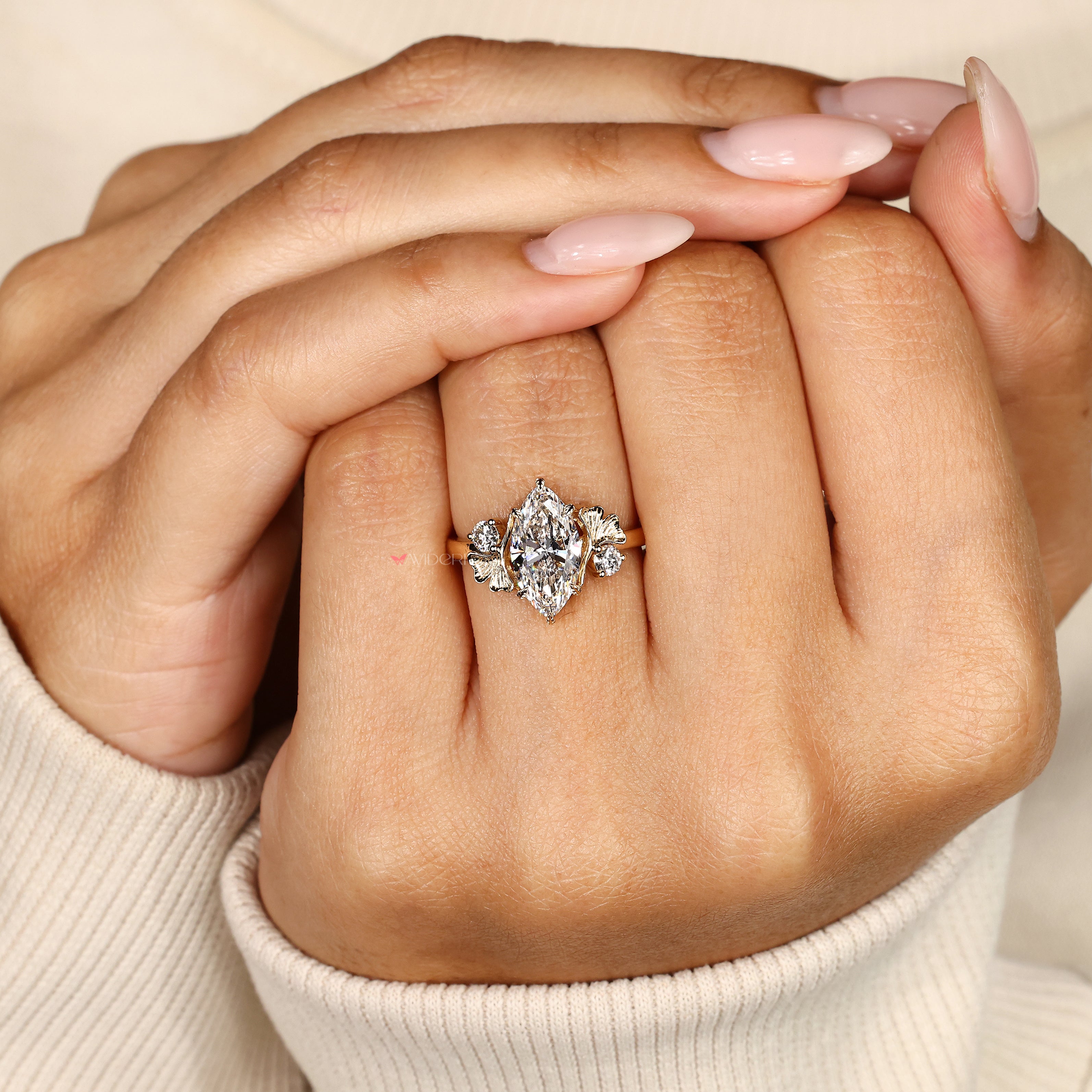 Six leaf prong marquise diamond ring design.
