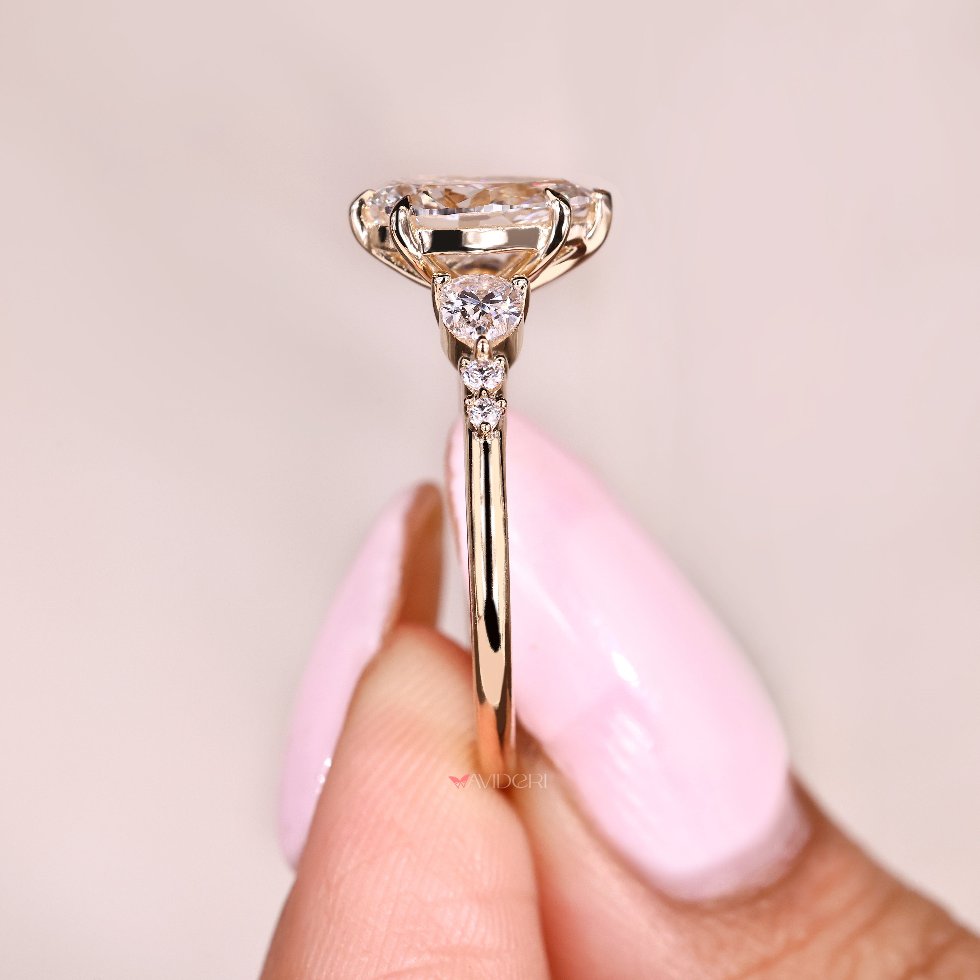 Pear cut engagement ring with secure five claw prongs
