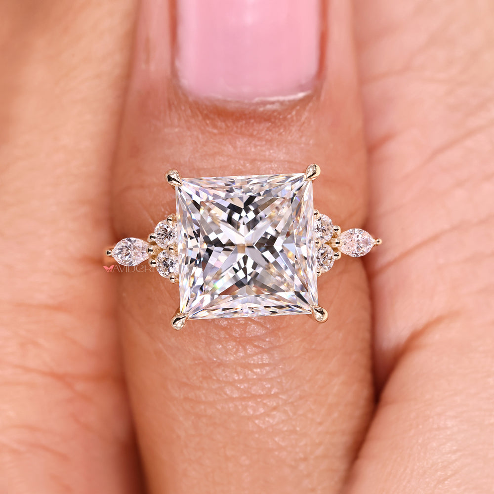 Muse setting princess cut diamond ring with tapered shank.