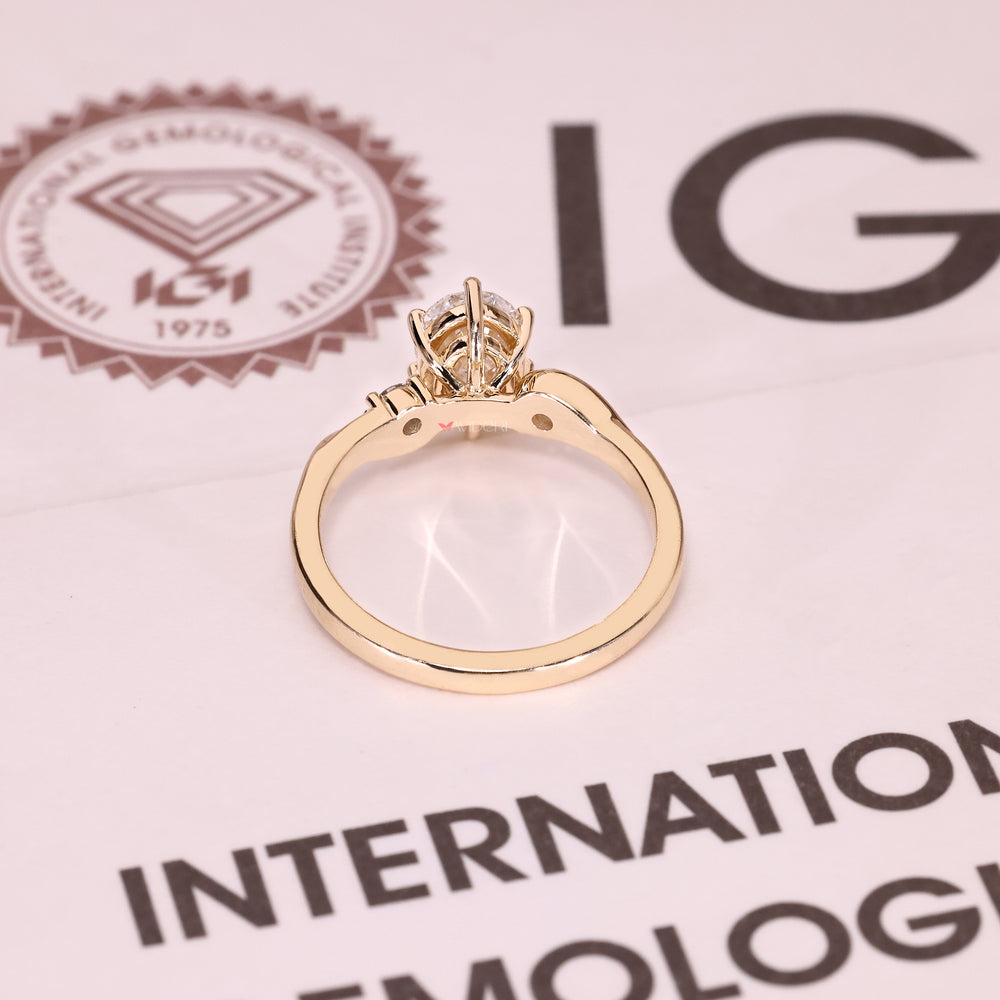 Handmade oval diamond ring with round accent side stones

