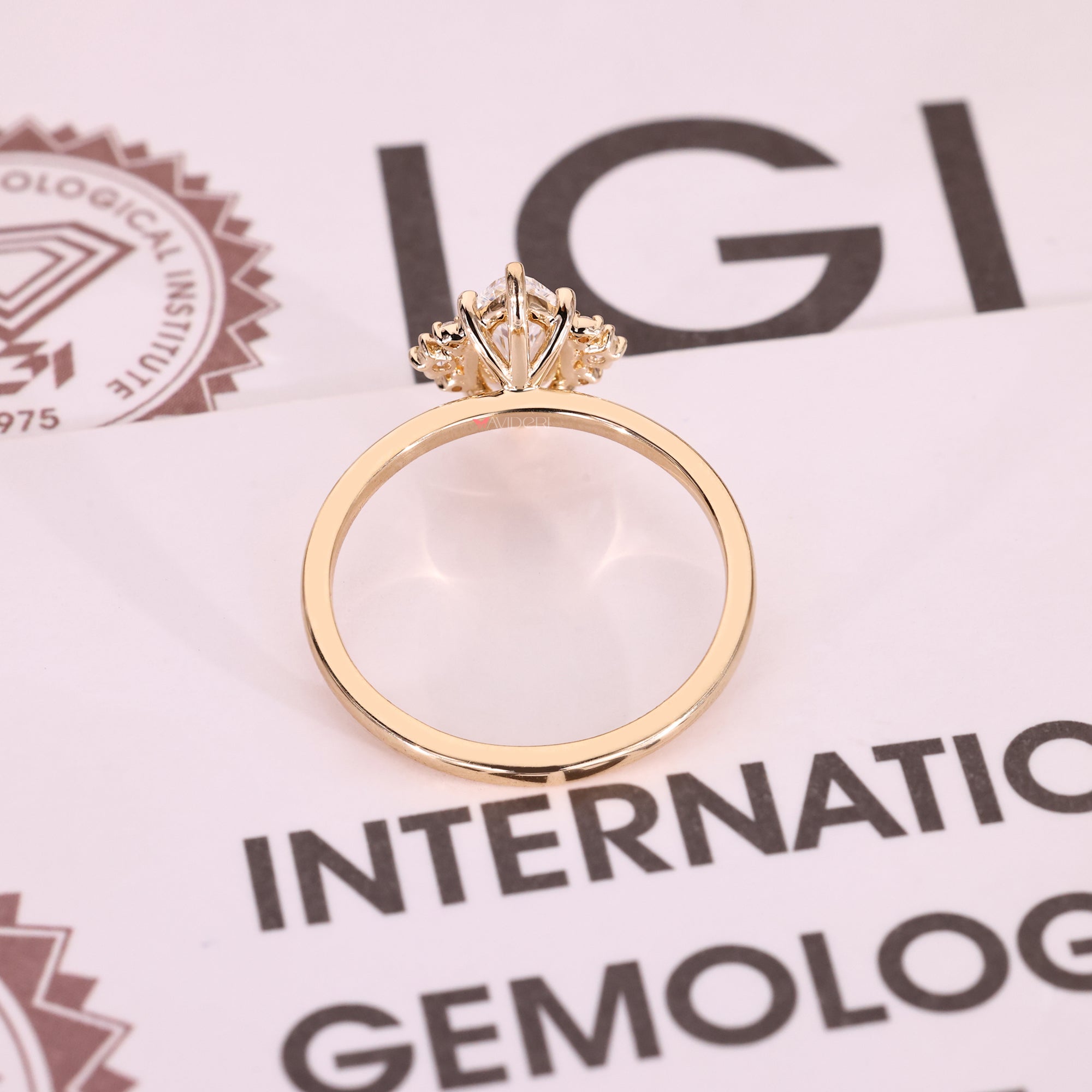 Handmade marquise diamond ring with round side stones.
