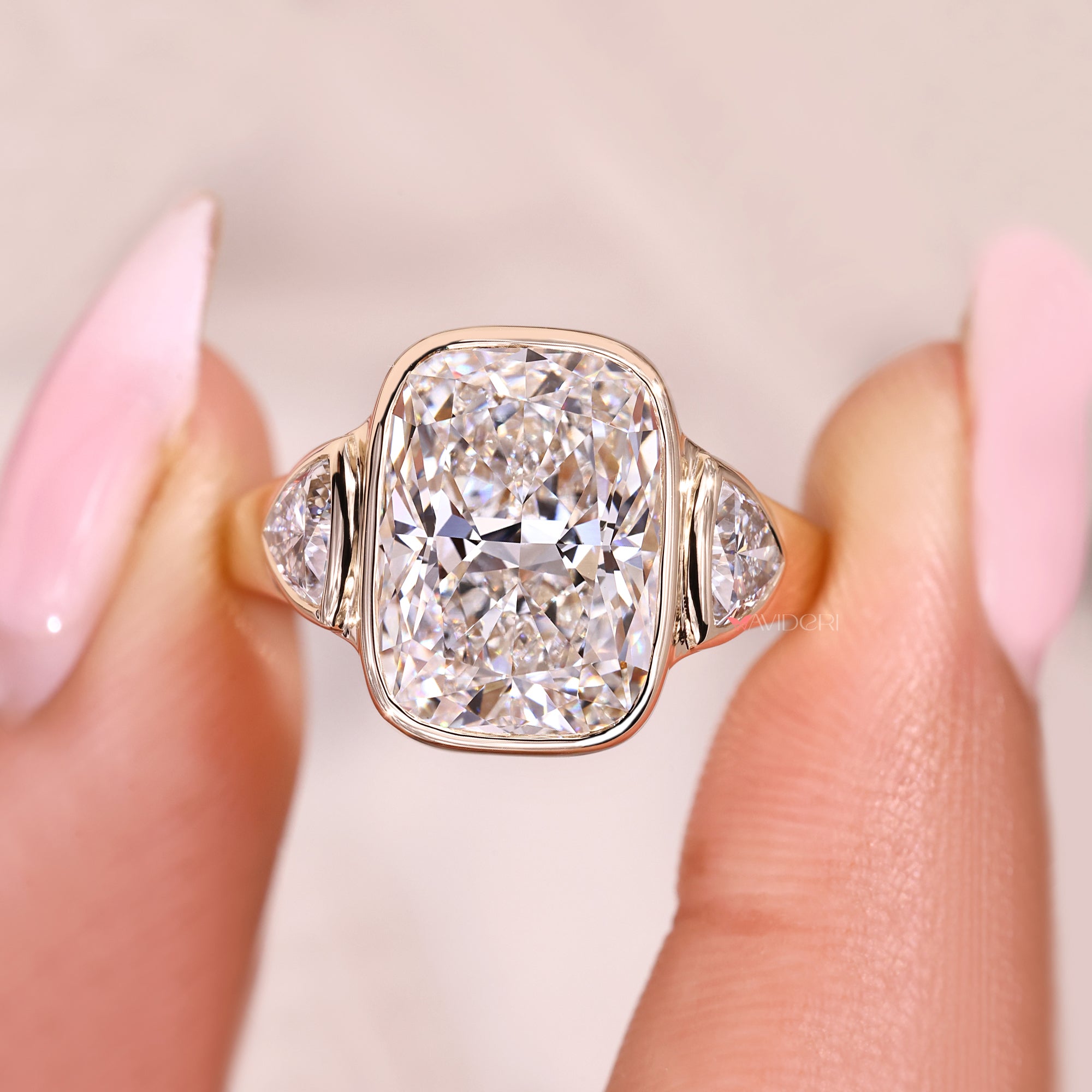 Lab grown cushion cut diamond ring with cathedral setting.