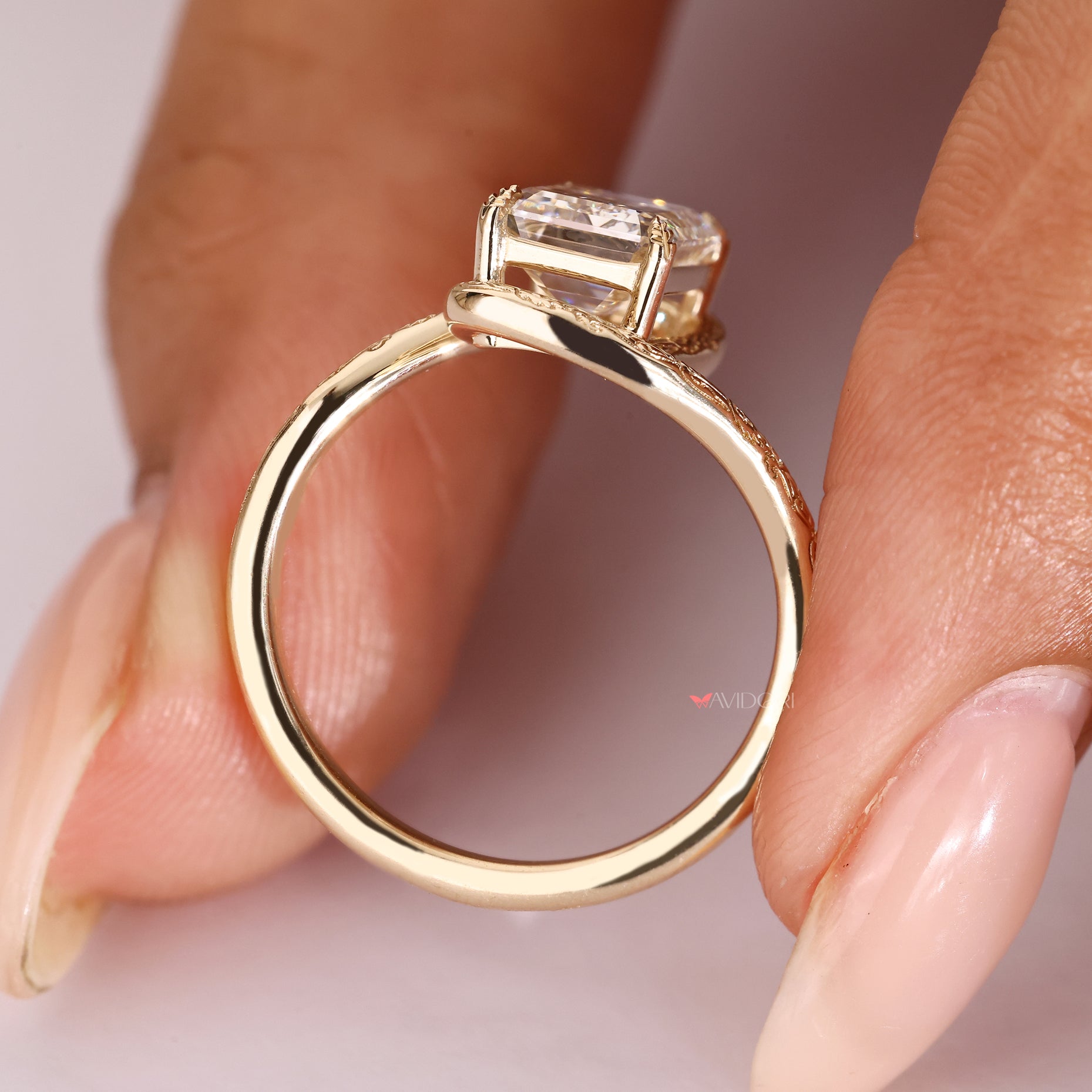 Emerald cut ring with leaf style prong setting.
