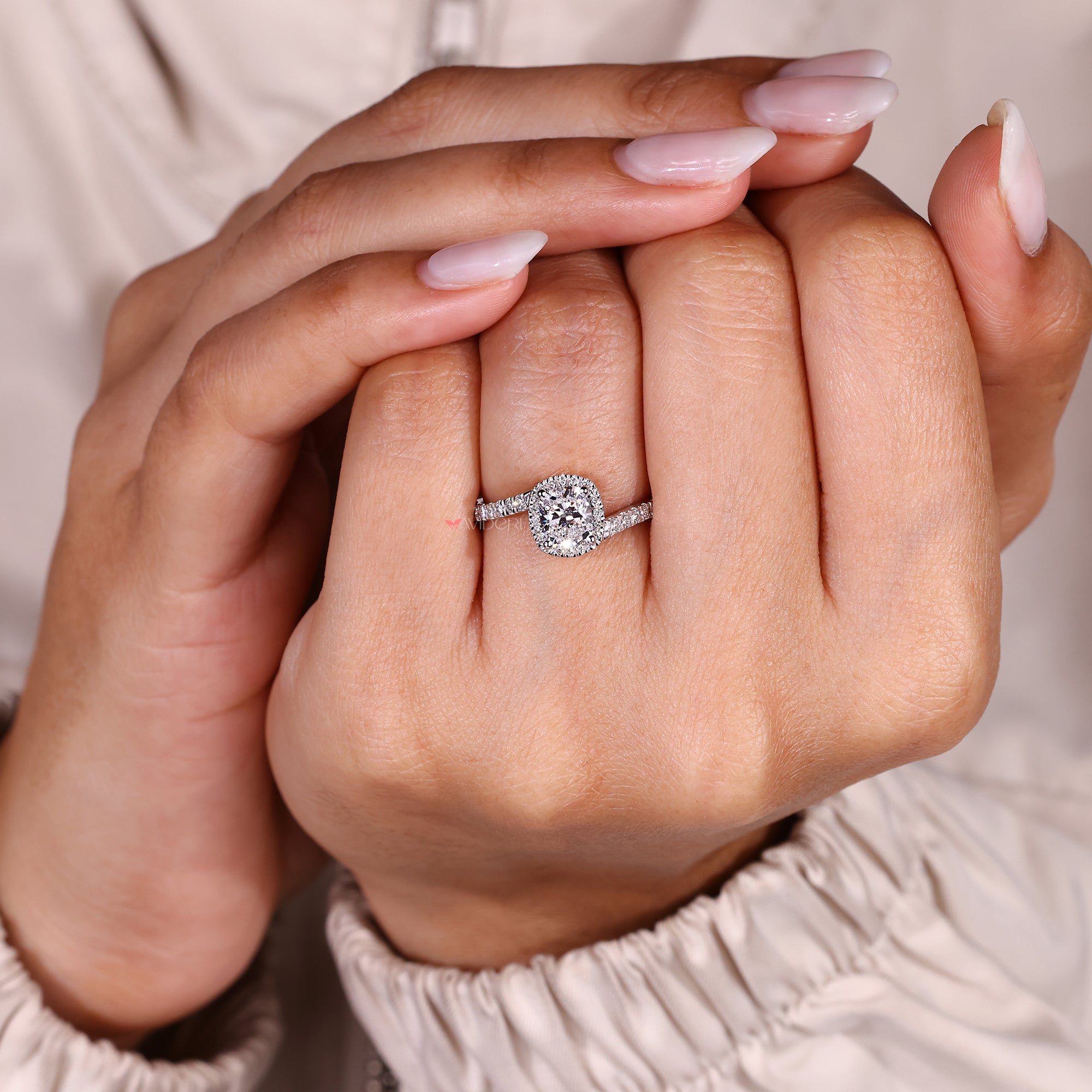 Avideri cushion cut diamond ring with halo design.