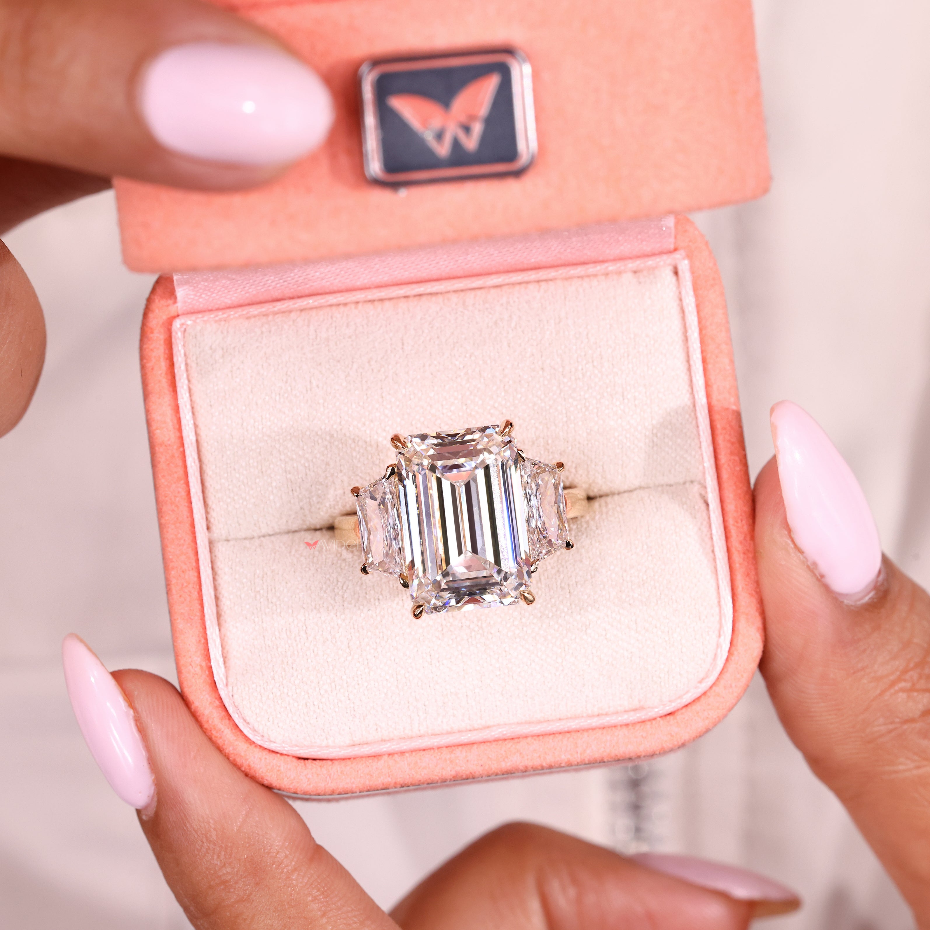 Emerald cut lab diamond ring with basket style setting
