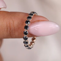 Black Round Wedding Band In Shared Prong Setting