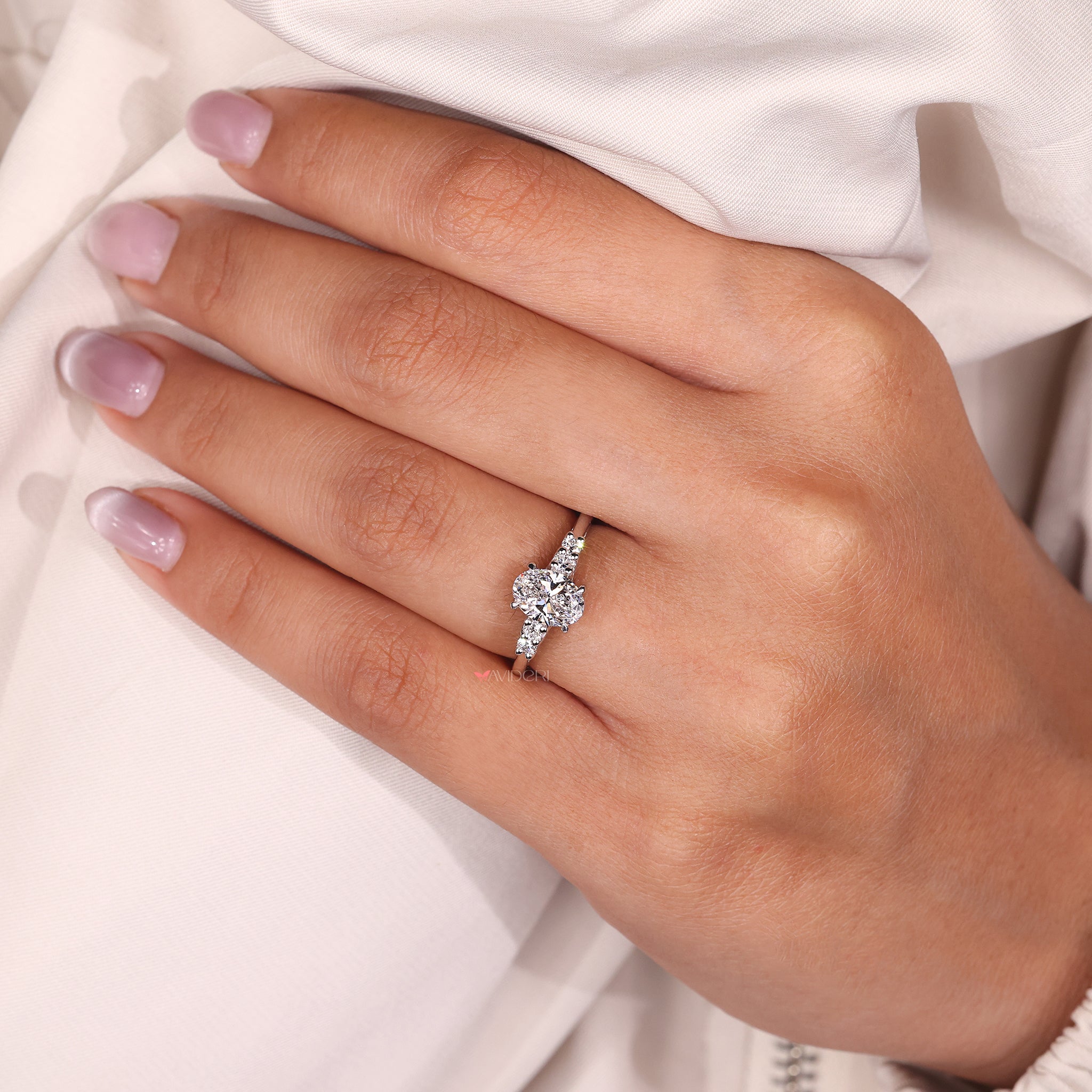 Five stone diamond ring designed with lab grown diamonds for a sustainable choice.
