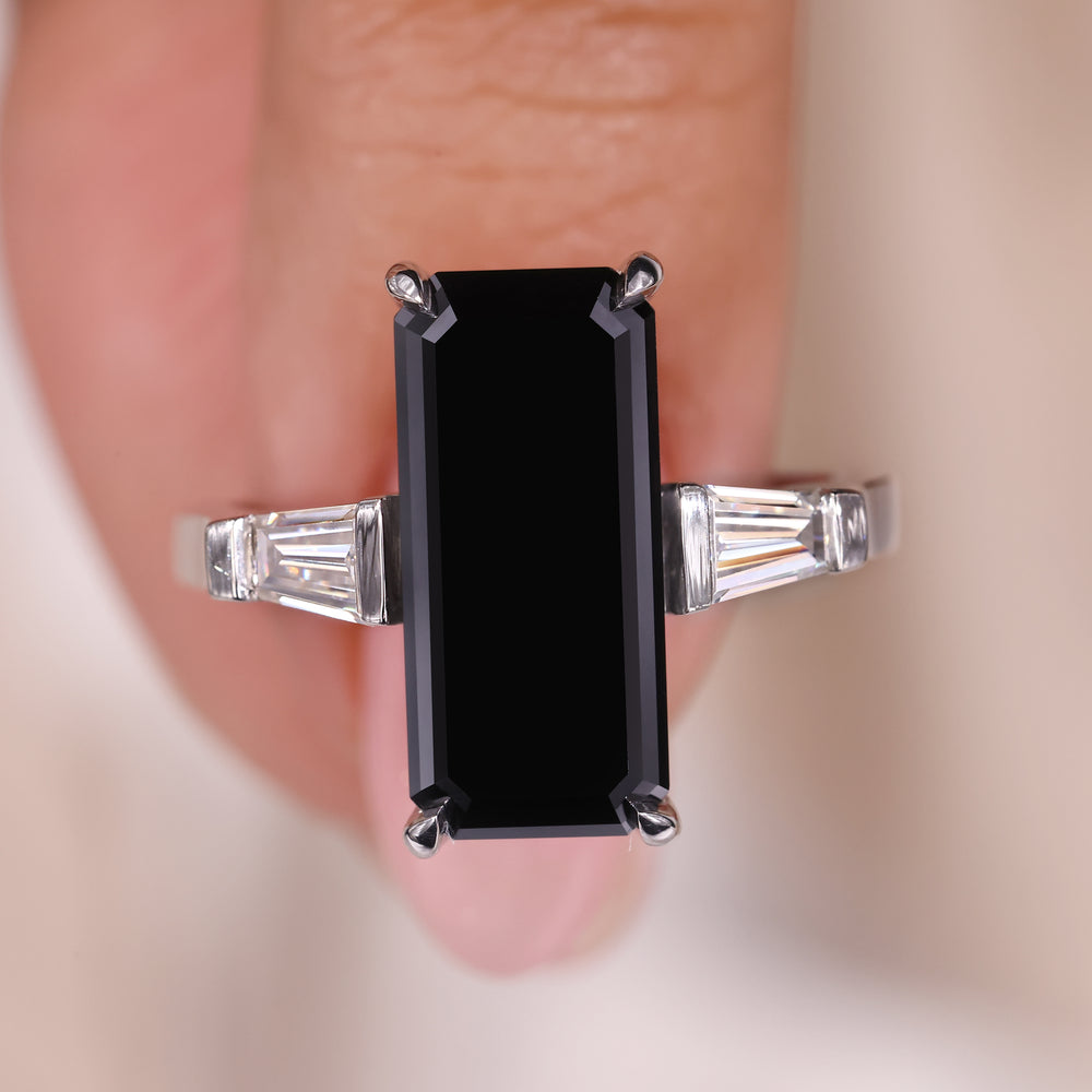 Bar Setting Ring featuring a stunning long emerald cut design.
