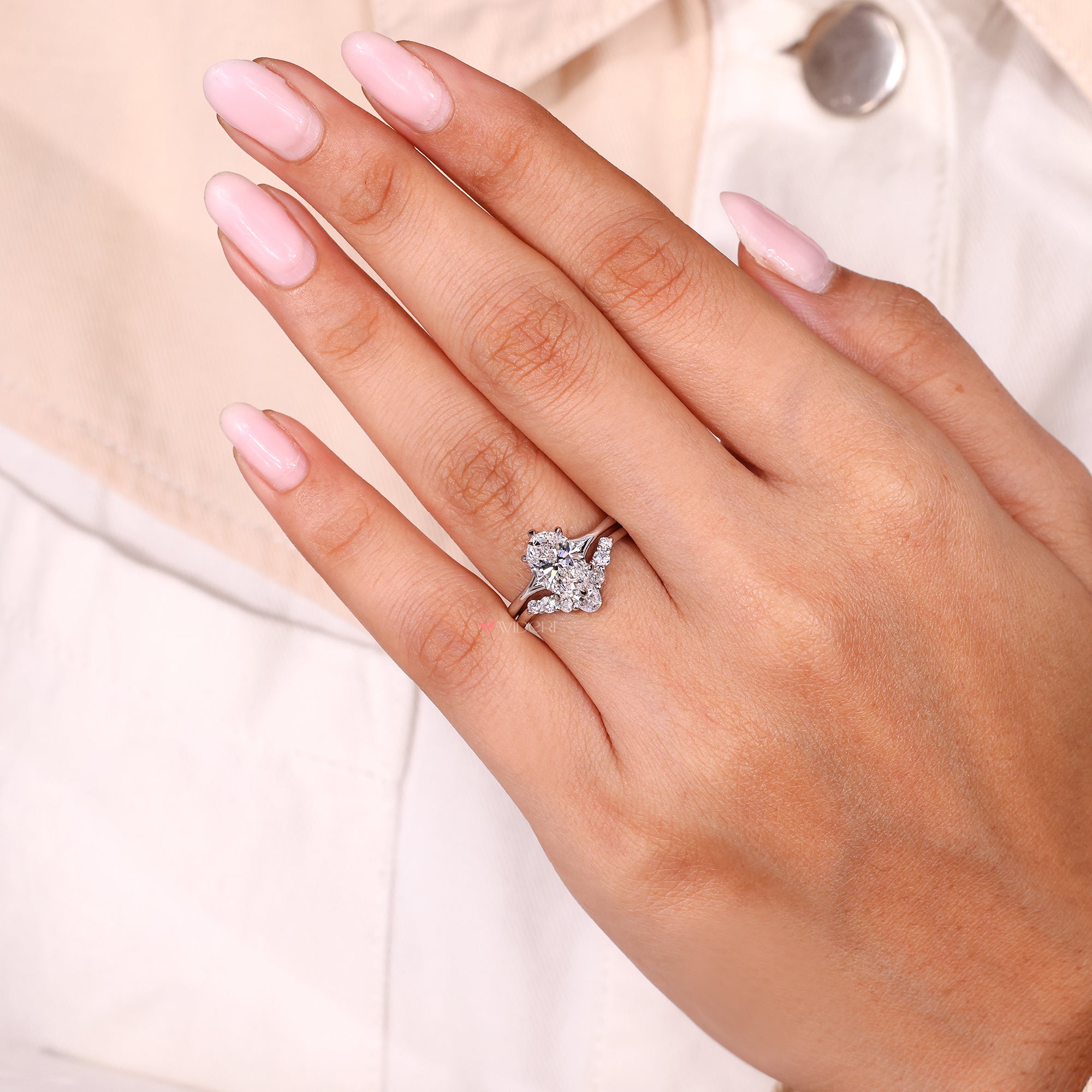 Curvy wedding band with shared prong wedding band.