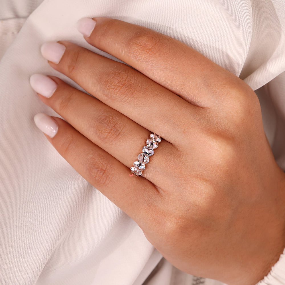 Oval diamond wedding band with six stone setting.
