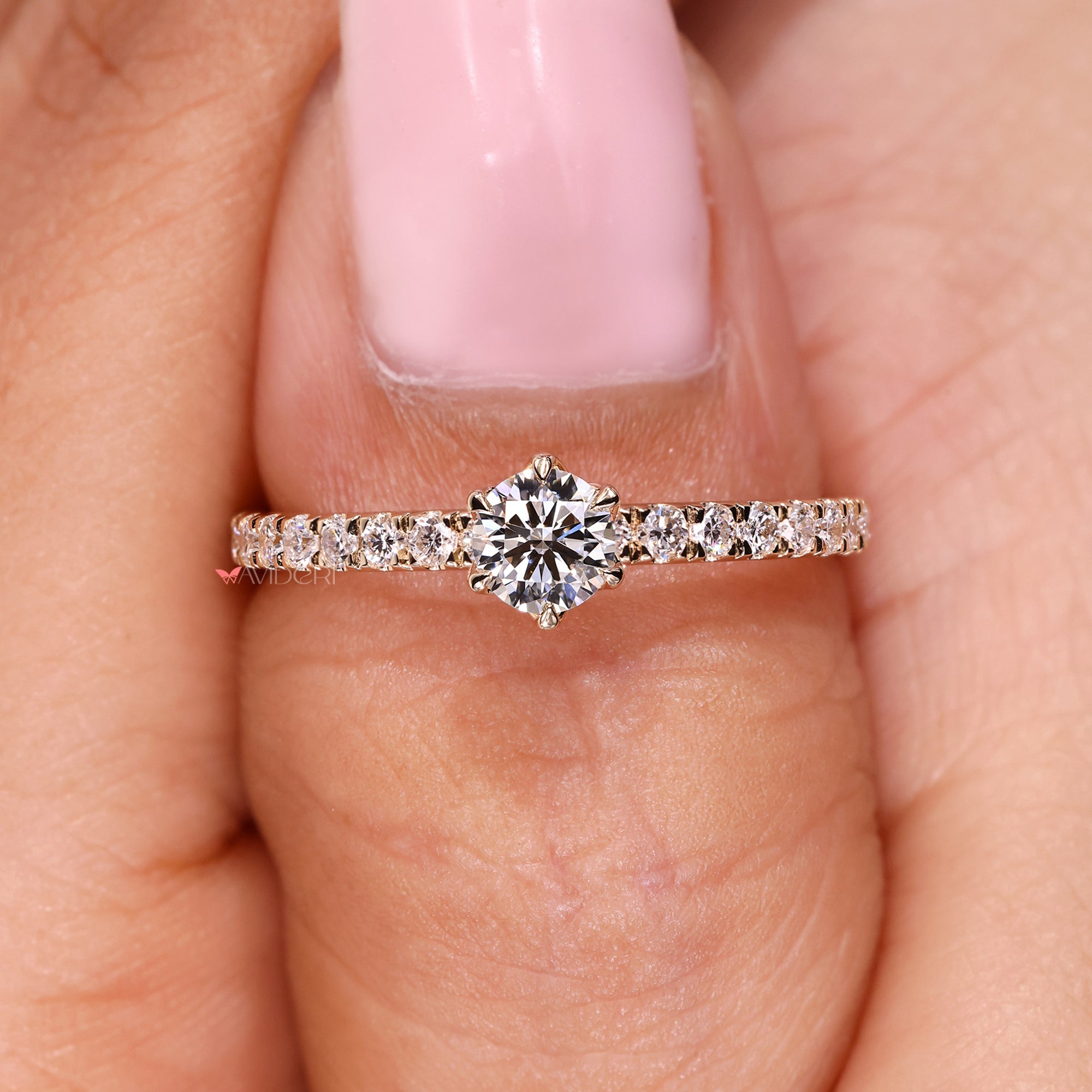 Lab-grown diamond ring with six claw prong setting ring.