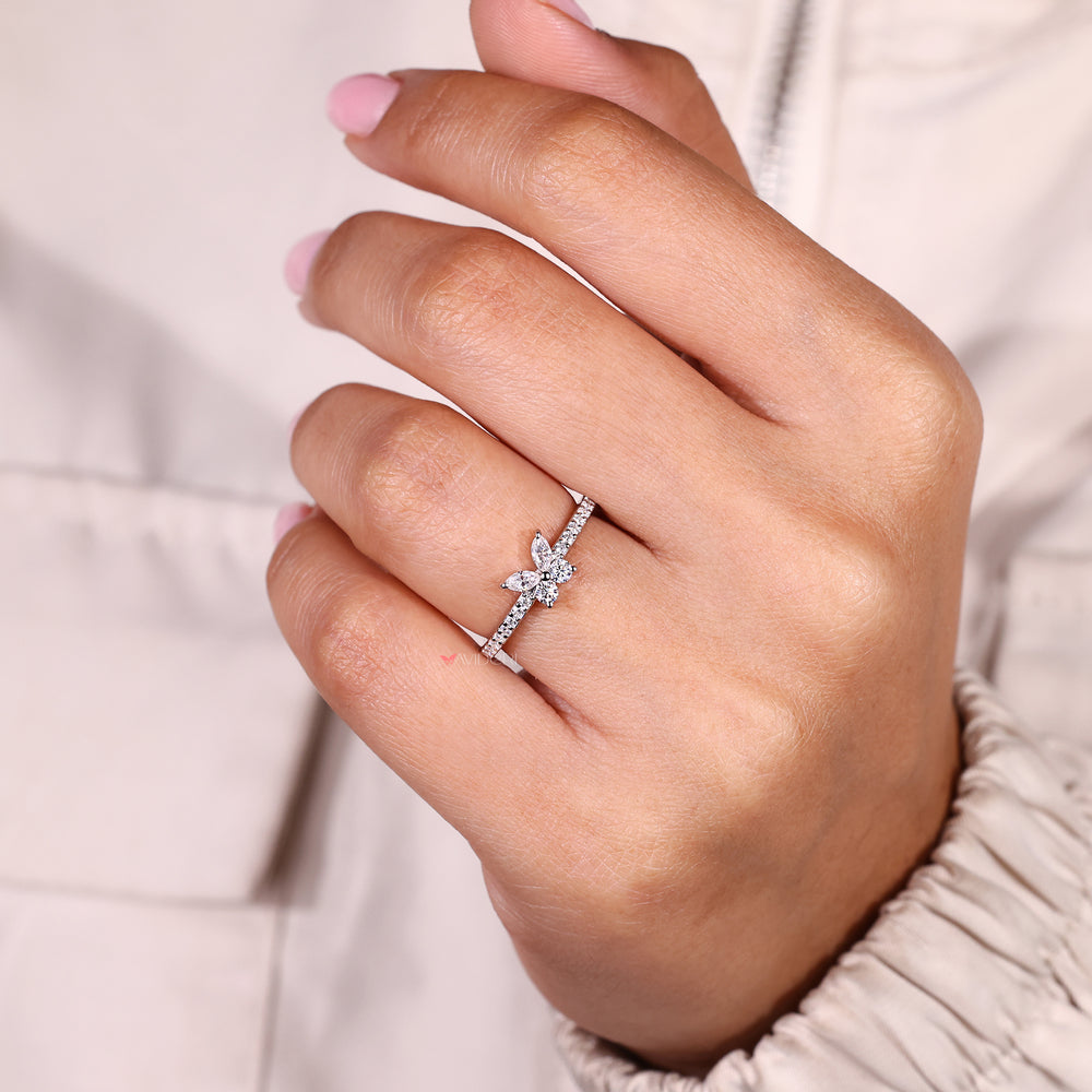 White gold ring with a butterfly-inspired setting
