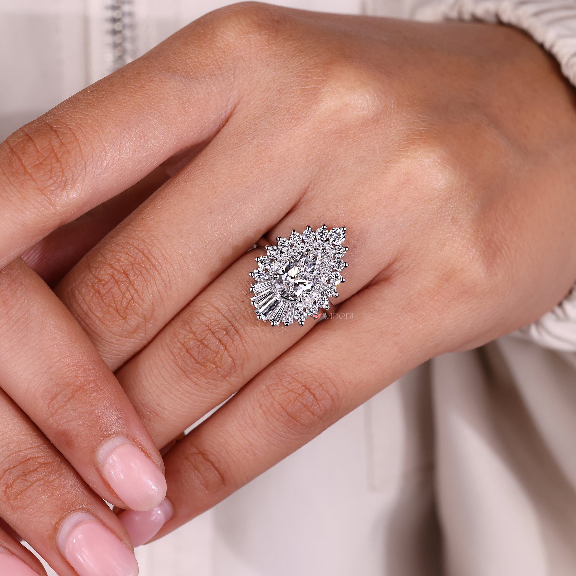 IGI certified on tapered baguette and round side stone.