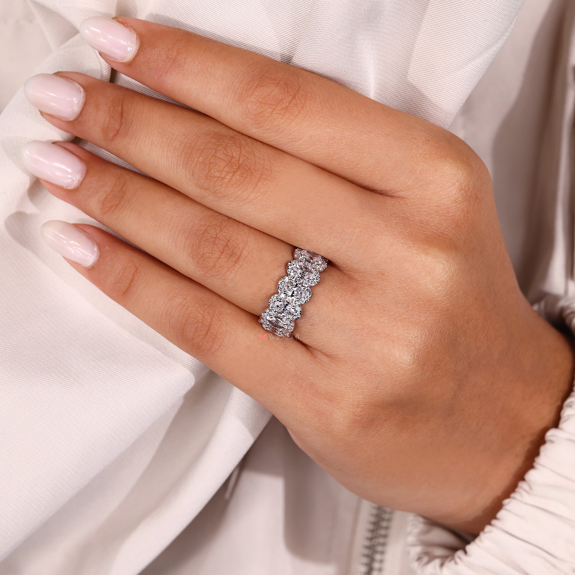 Halo wedding band with prong setting.