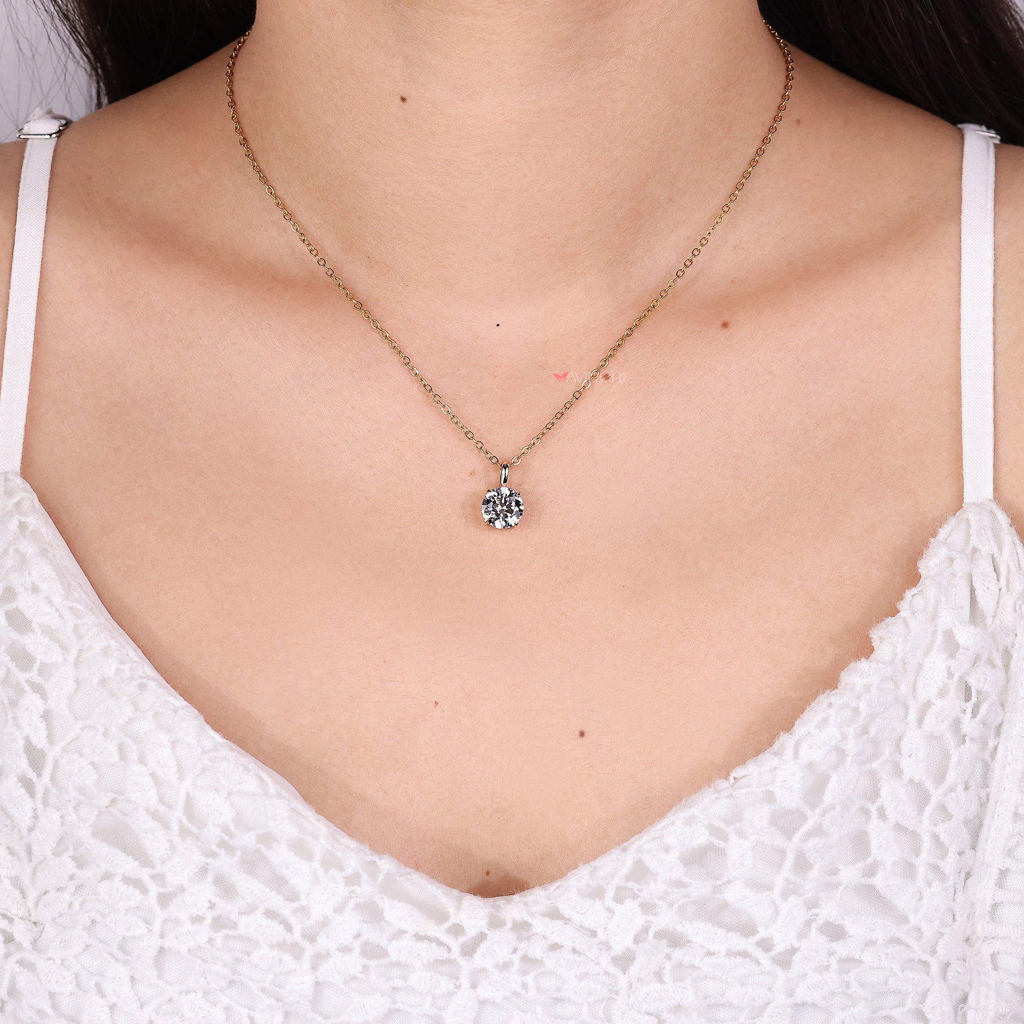 Round cut diamond pendant crafted with secure claw design.