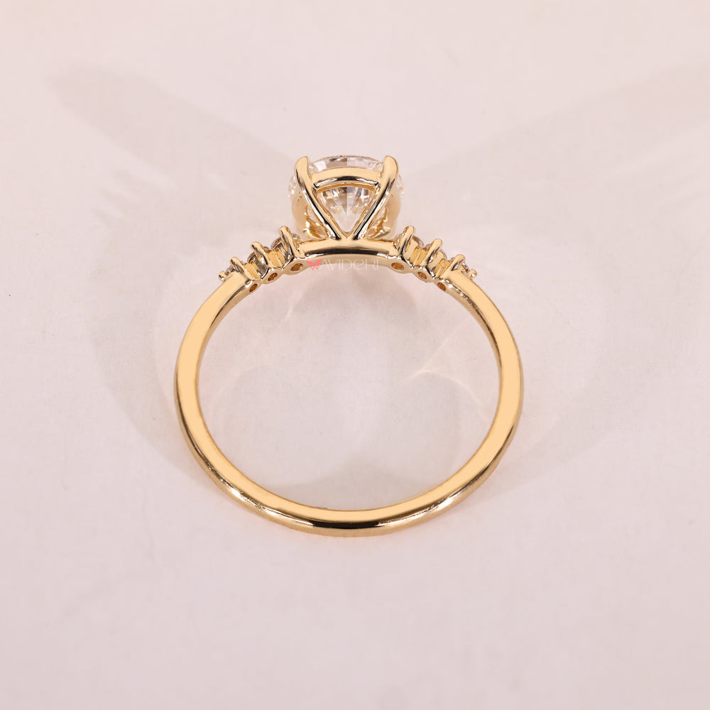 Yellow gold engagement ring with seven round diamonds.