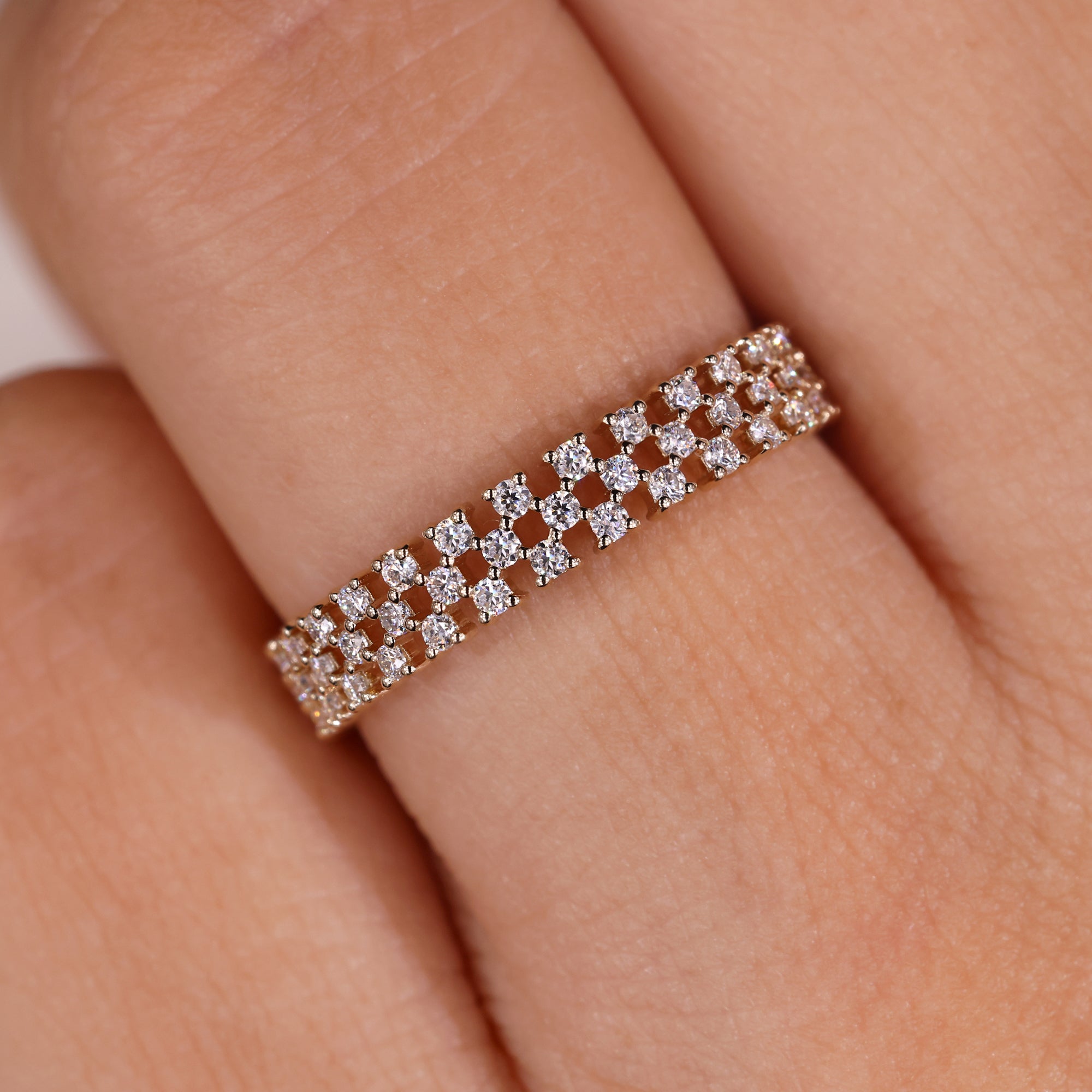 Handmade eternity band with triple pave rows.