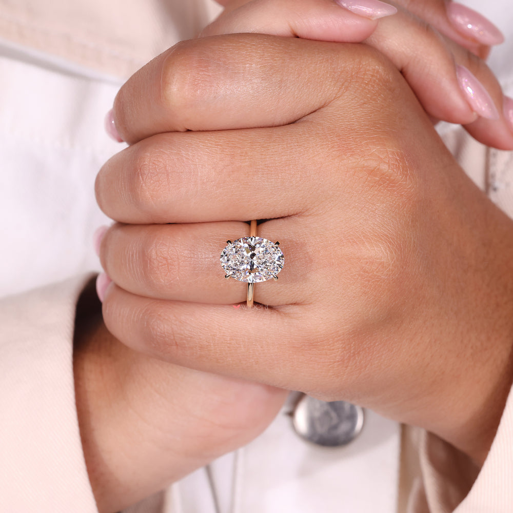 4 Prong Ring featuring an oval cut diamond, designed for durability and elegance.