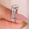 White gold bridal sets featuring a cushion cut ring with classic wedding band.