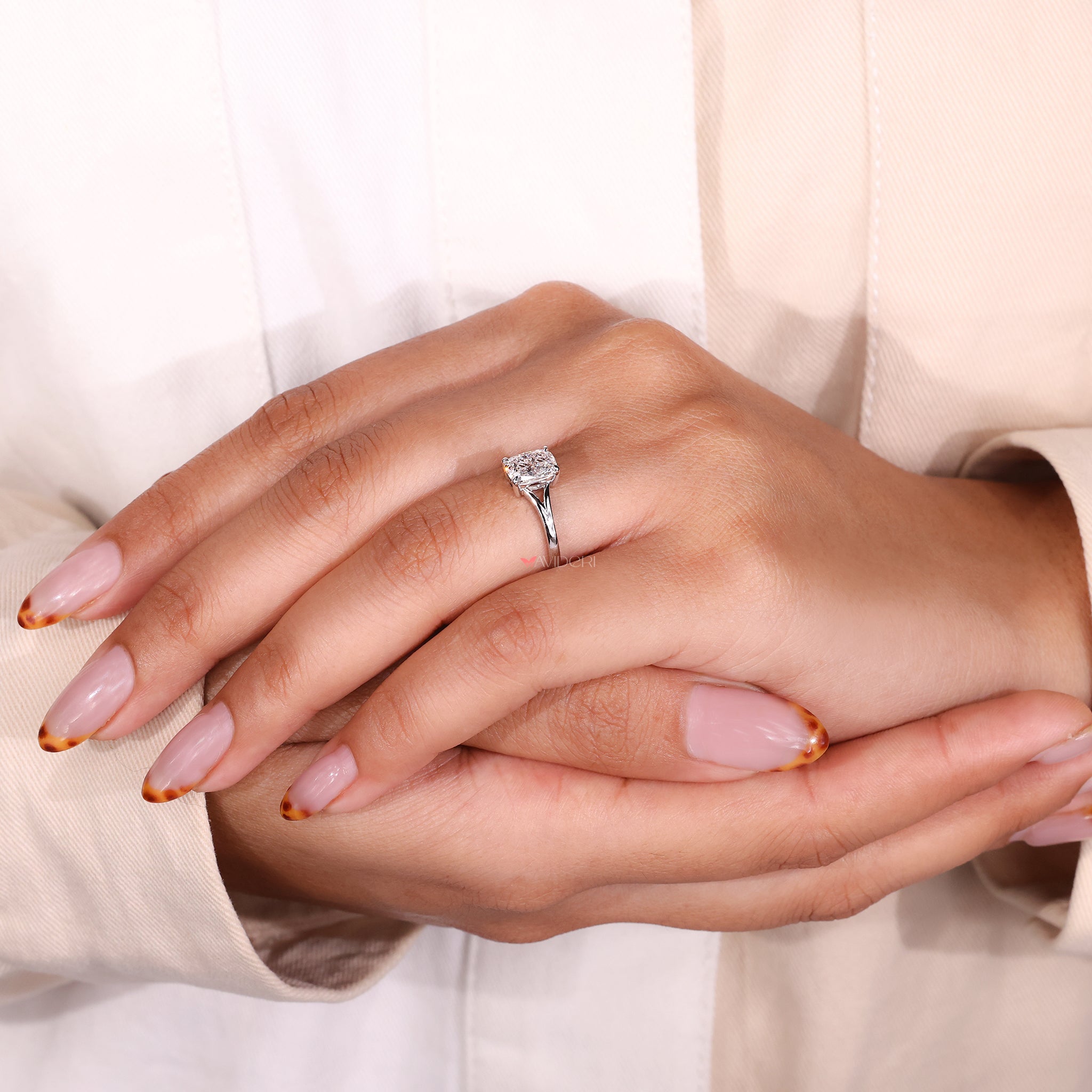 Cushion cut ring in a white gold 4 claw prong setting for a classic look.