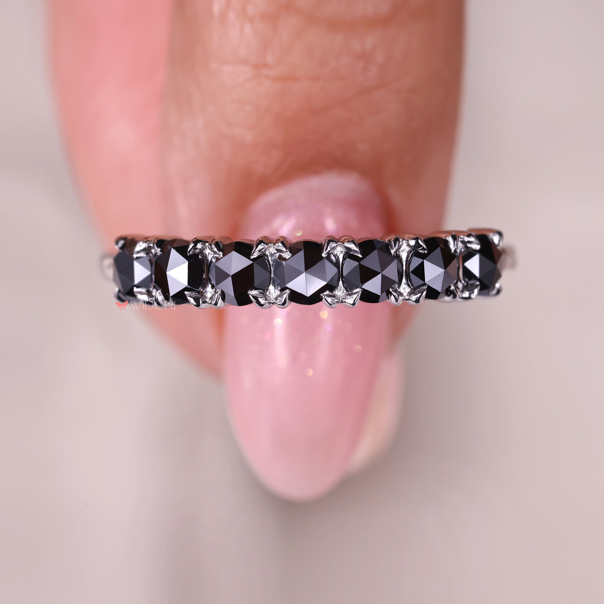 This seven stone band features continuous sparkle and shine.