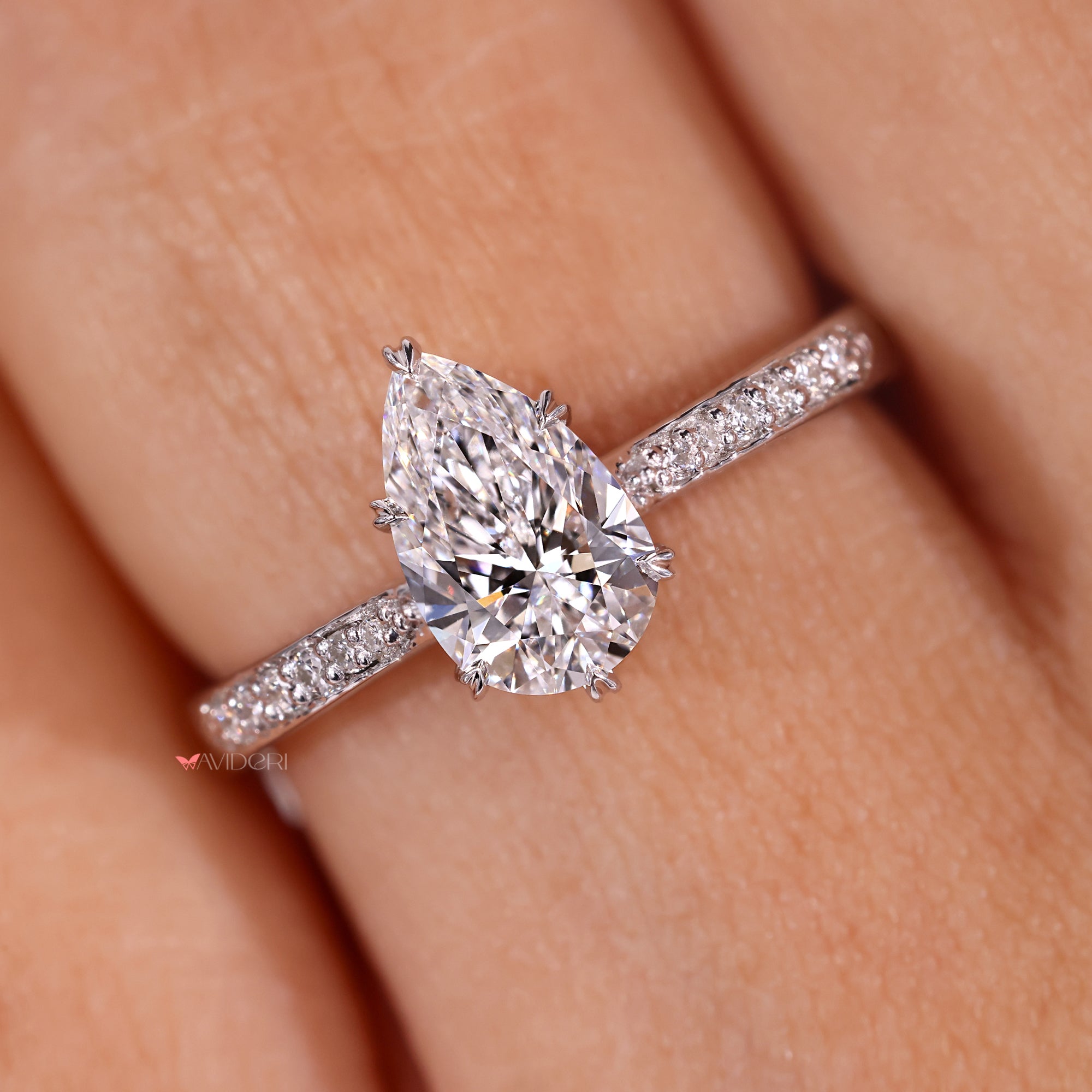 Prong setting engagement ring with pear cut.