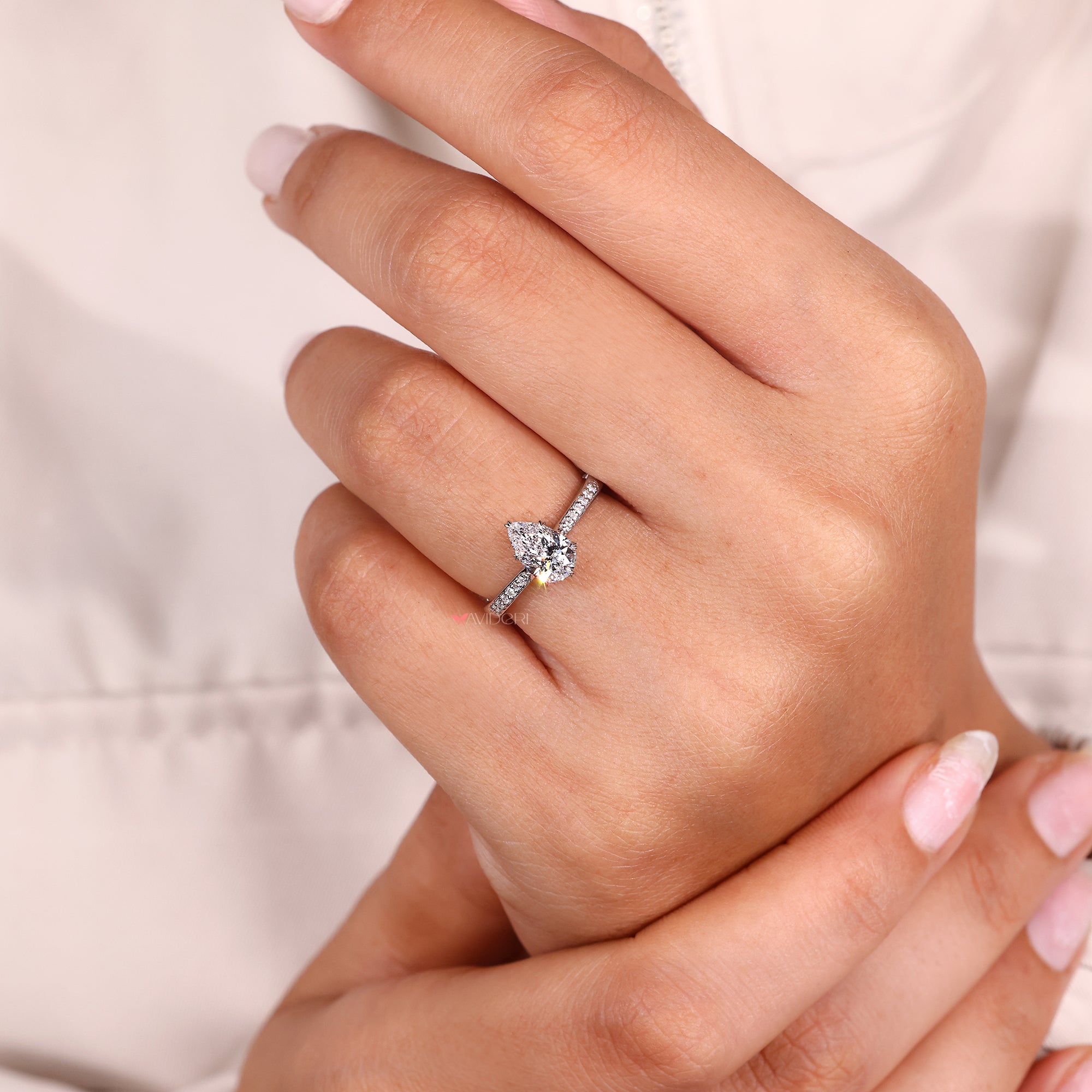 Avidéri engagement ring featuring pear diamond.