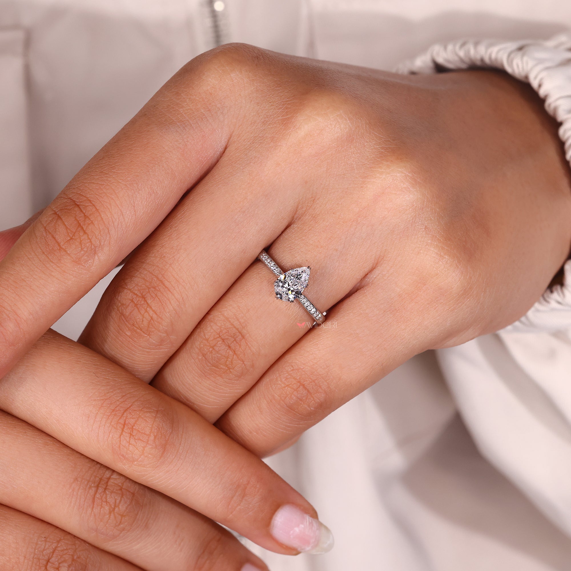 Lab grown pear diamond ring for her.
