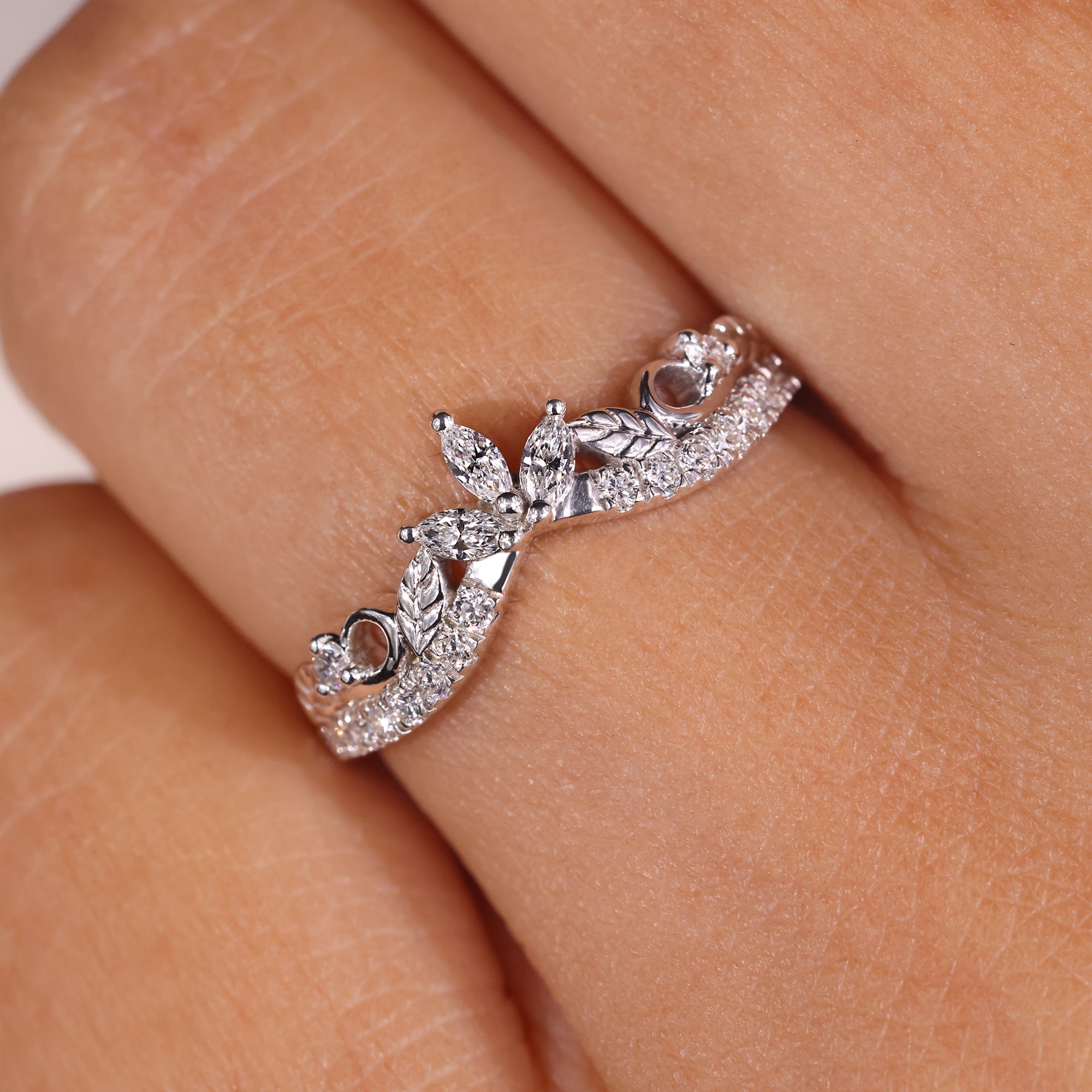 Curvy shaped band with round diamonds, offering a smooth, flowing design.