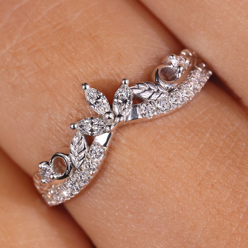 Curvy shaped band with round diamonds, offering a smooth, flowing design.