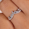 Curvy shaped band with round diamonds, offering a smooth, flowing design.
