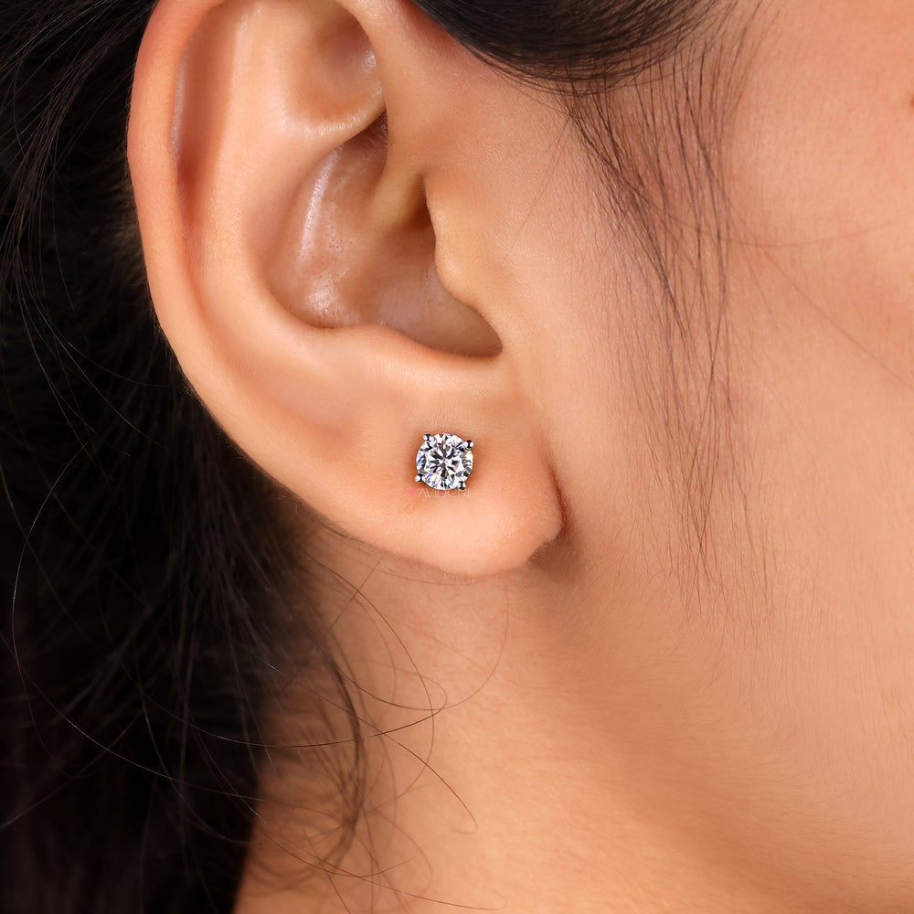 4 prong silver moissanite studs by Avideri.